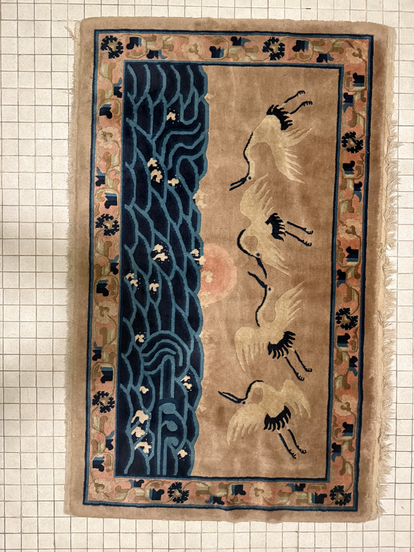 An antique Chinese pictorial rug