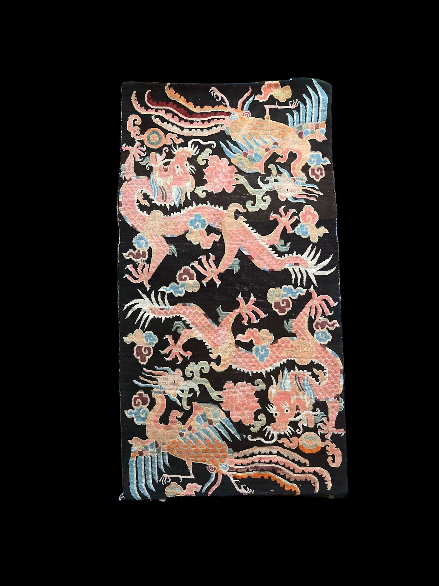 A mid 20th C., Tibetan dragon and phoenix rug