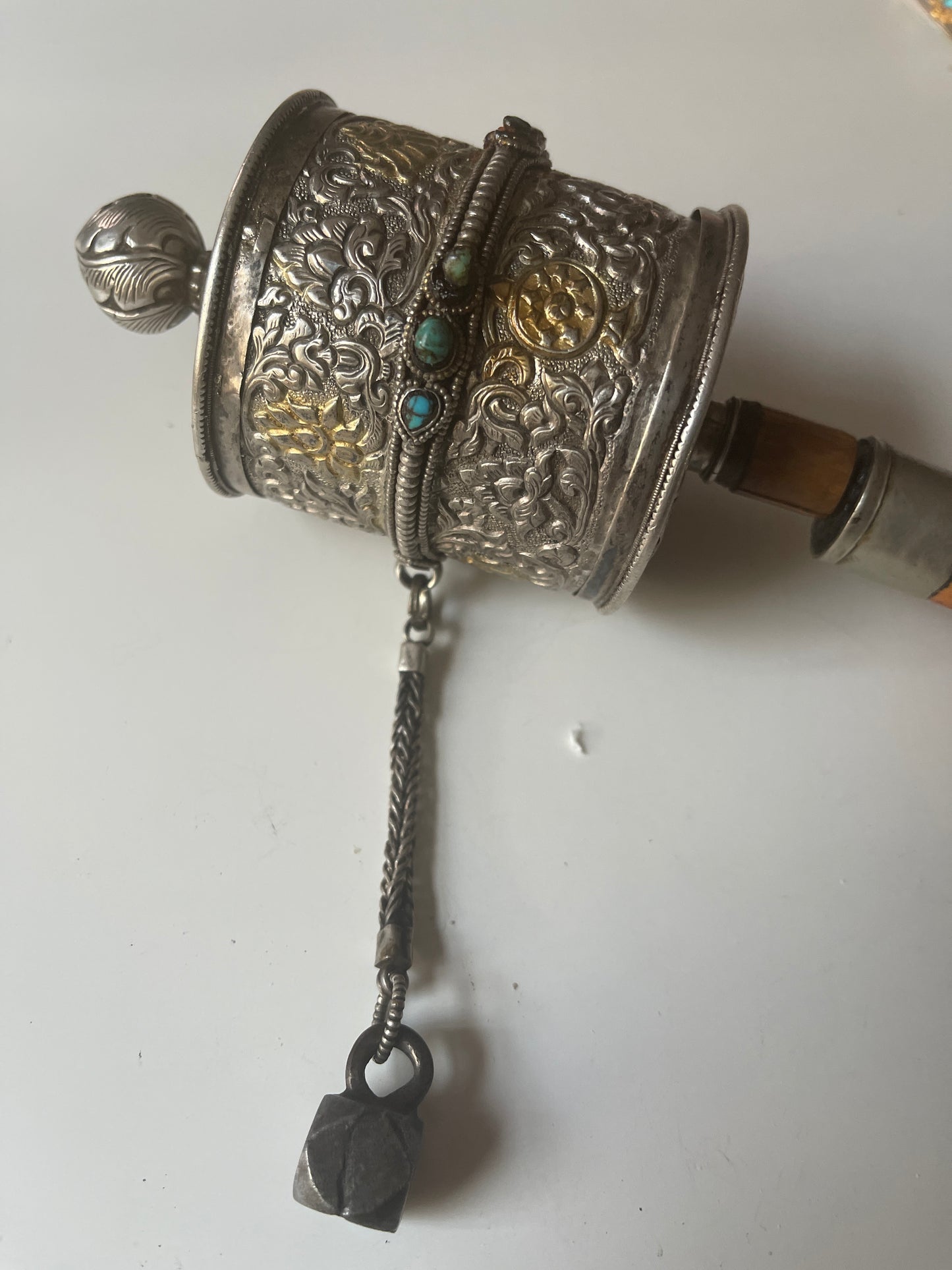 An antique Tibetan handheld prayer wheel