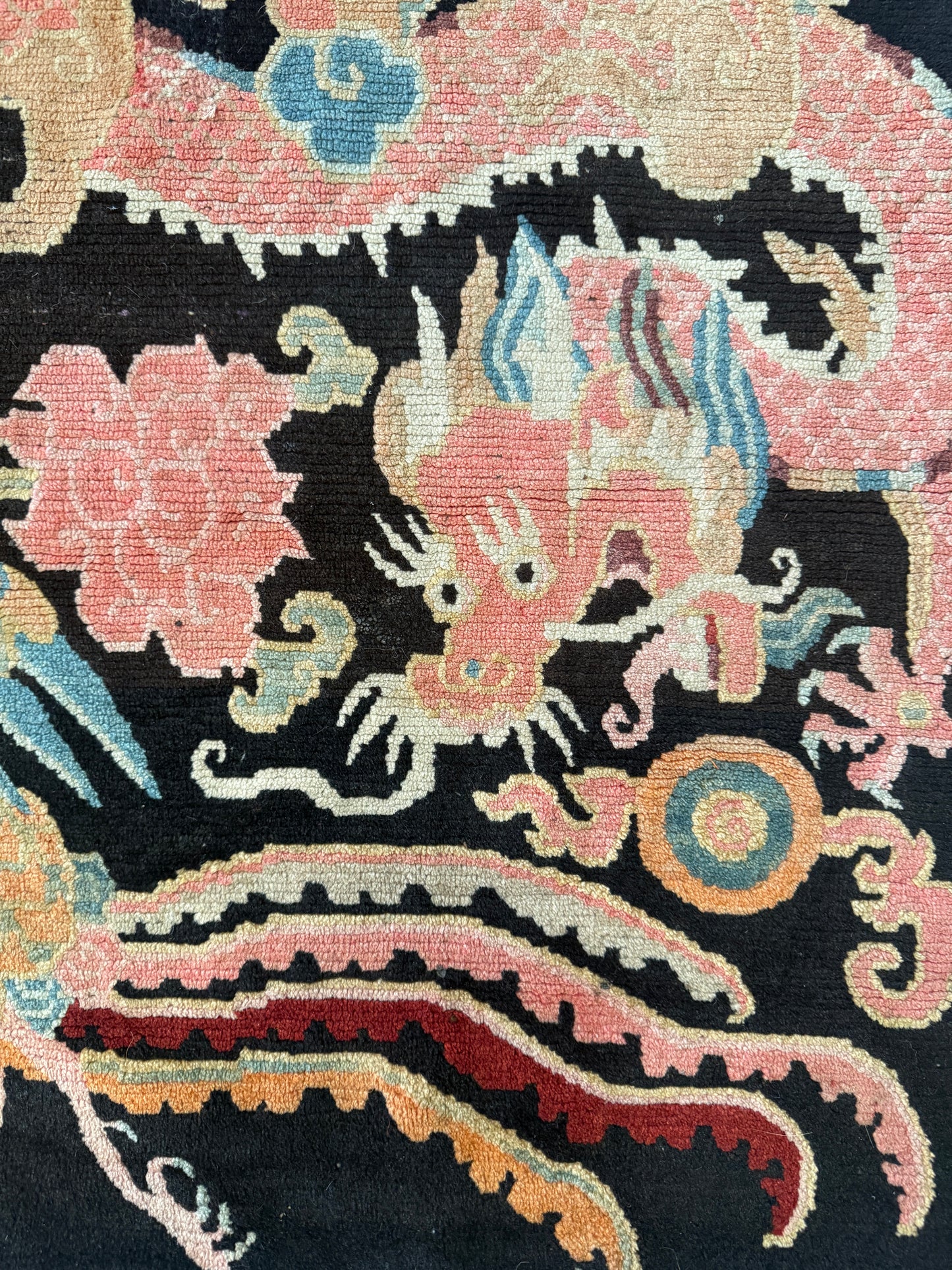 A mid 20th C., Tibetan dragon and phoenix rug