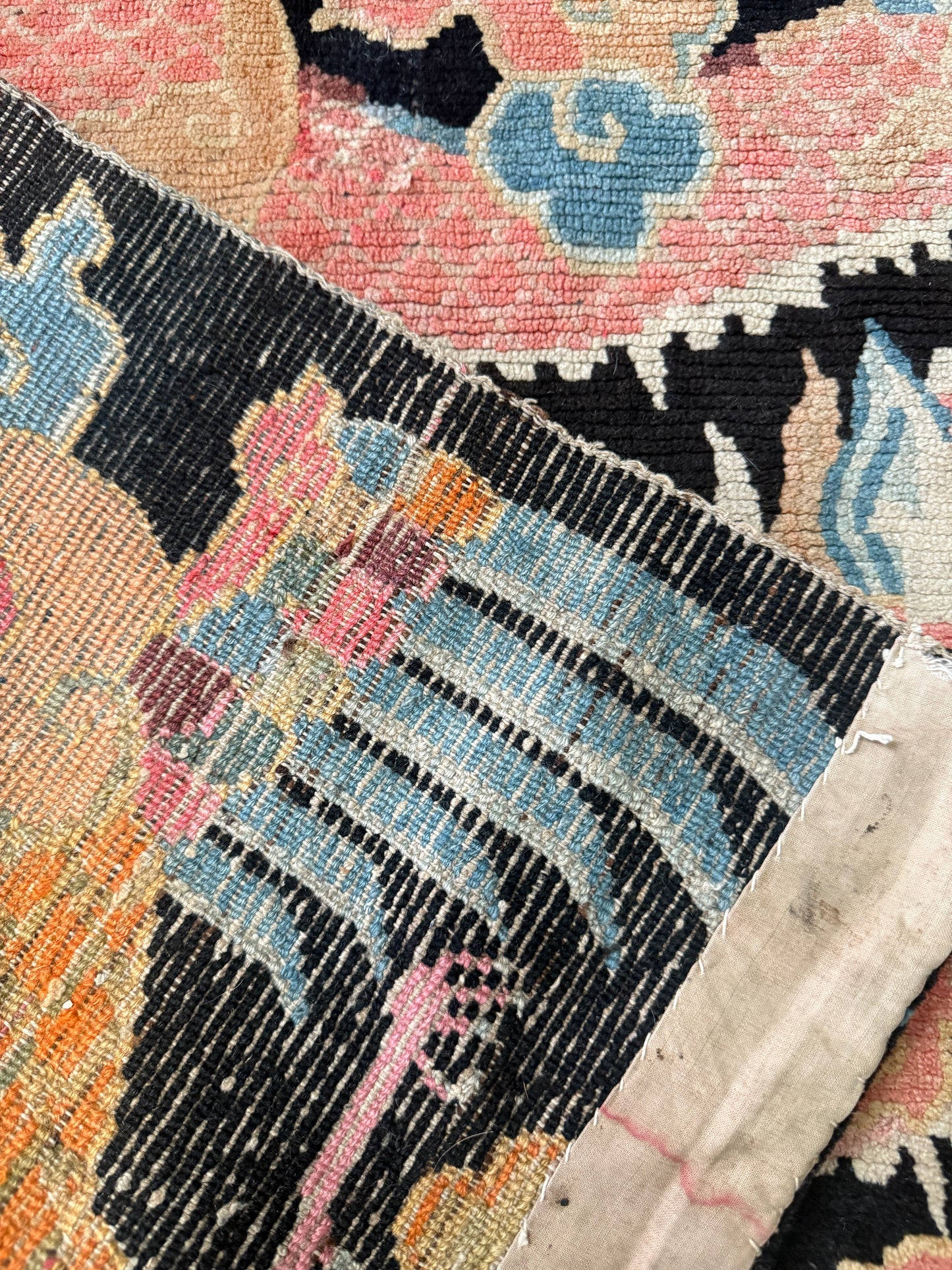 A mid 20th C., Tibetan dragon and phoenix rug