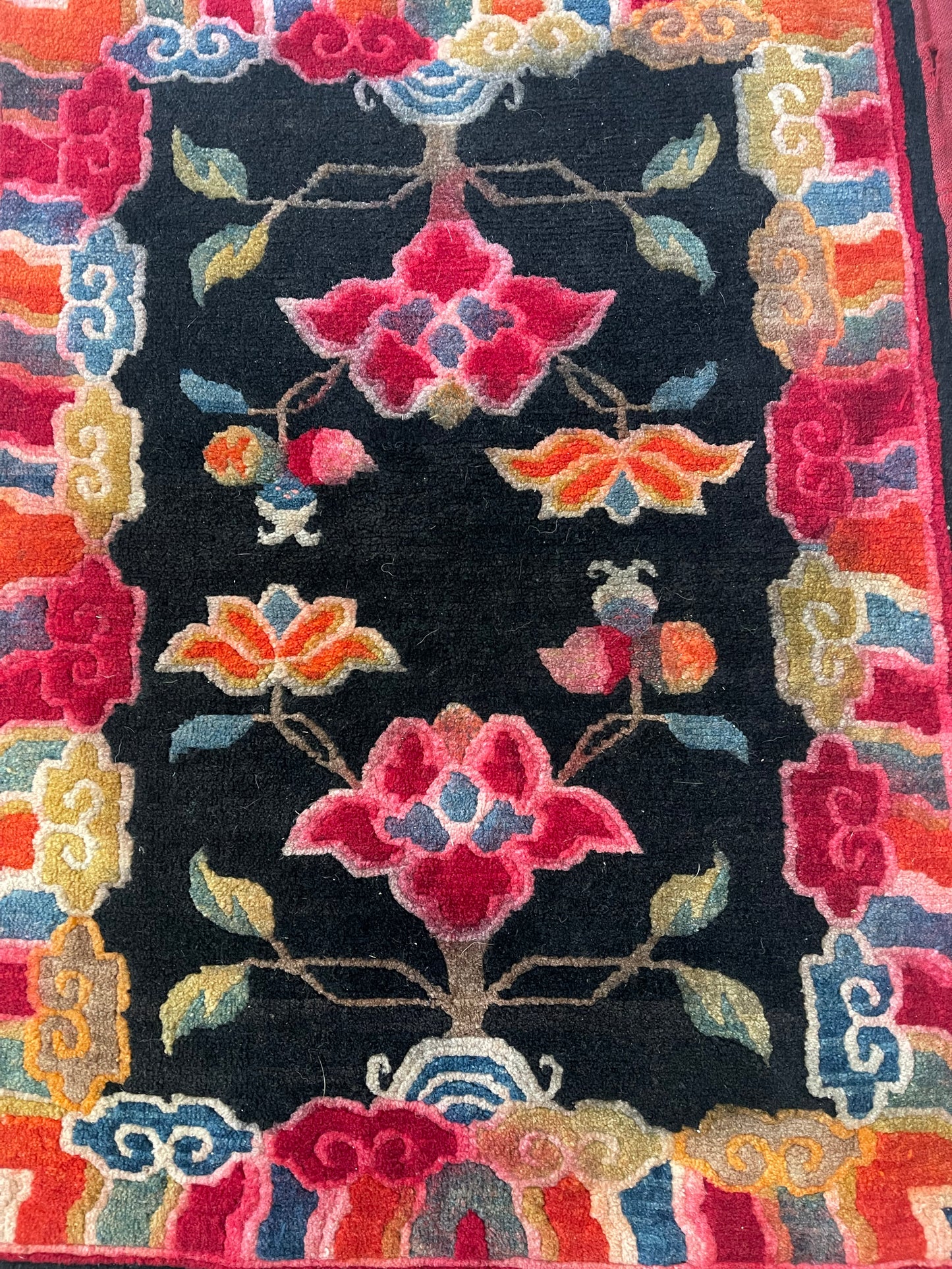 An early 20th C., antique Tibetan floral cushion rug