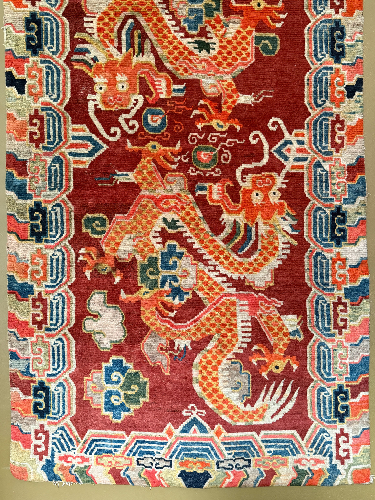 An early 20th C., antique Tibetan dragon rug