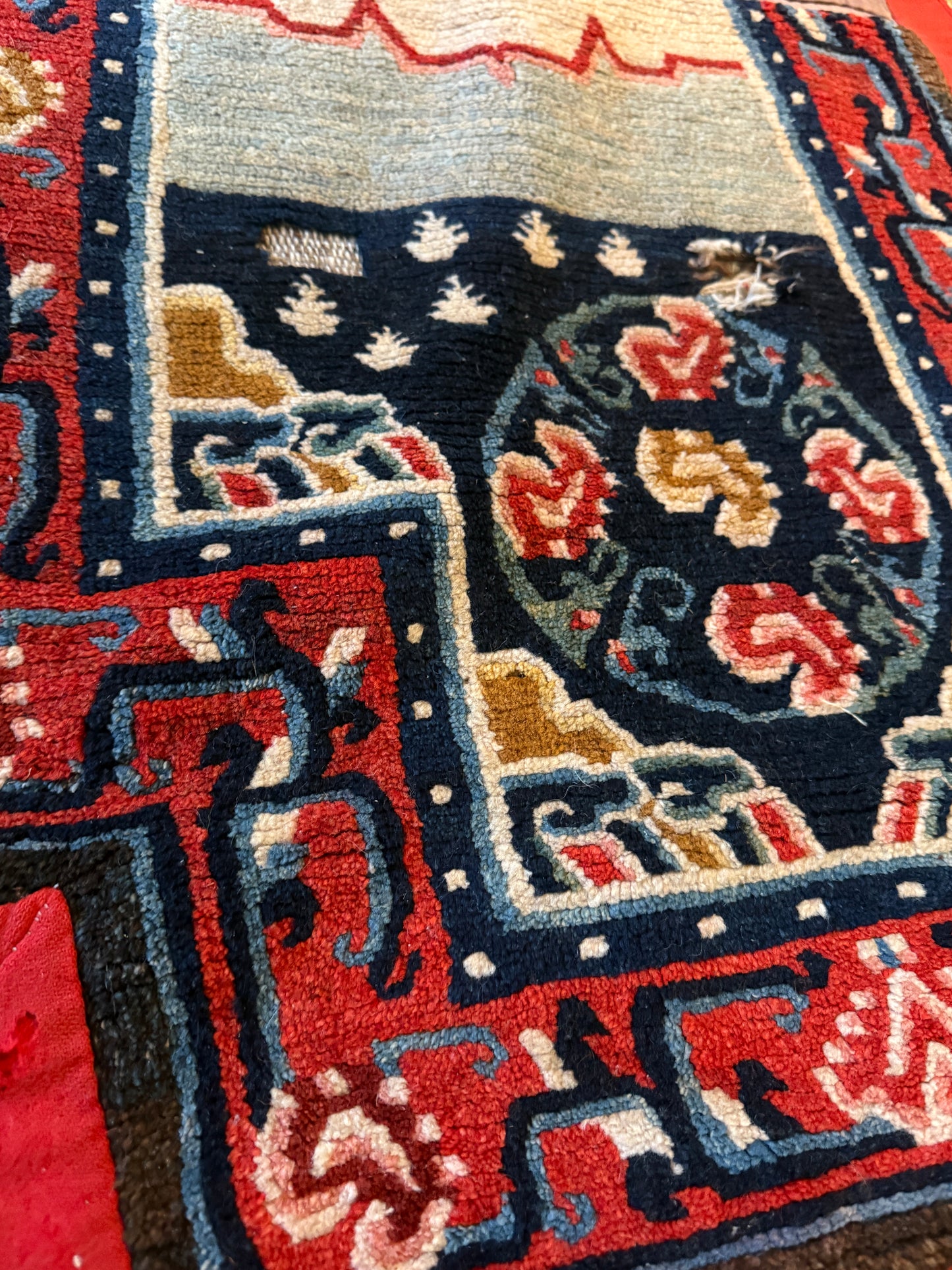 An antique Tibetan saddle rug and rug topper set