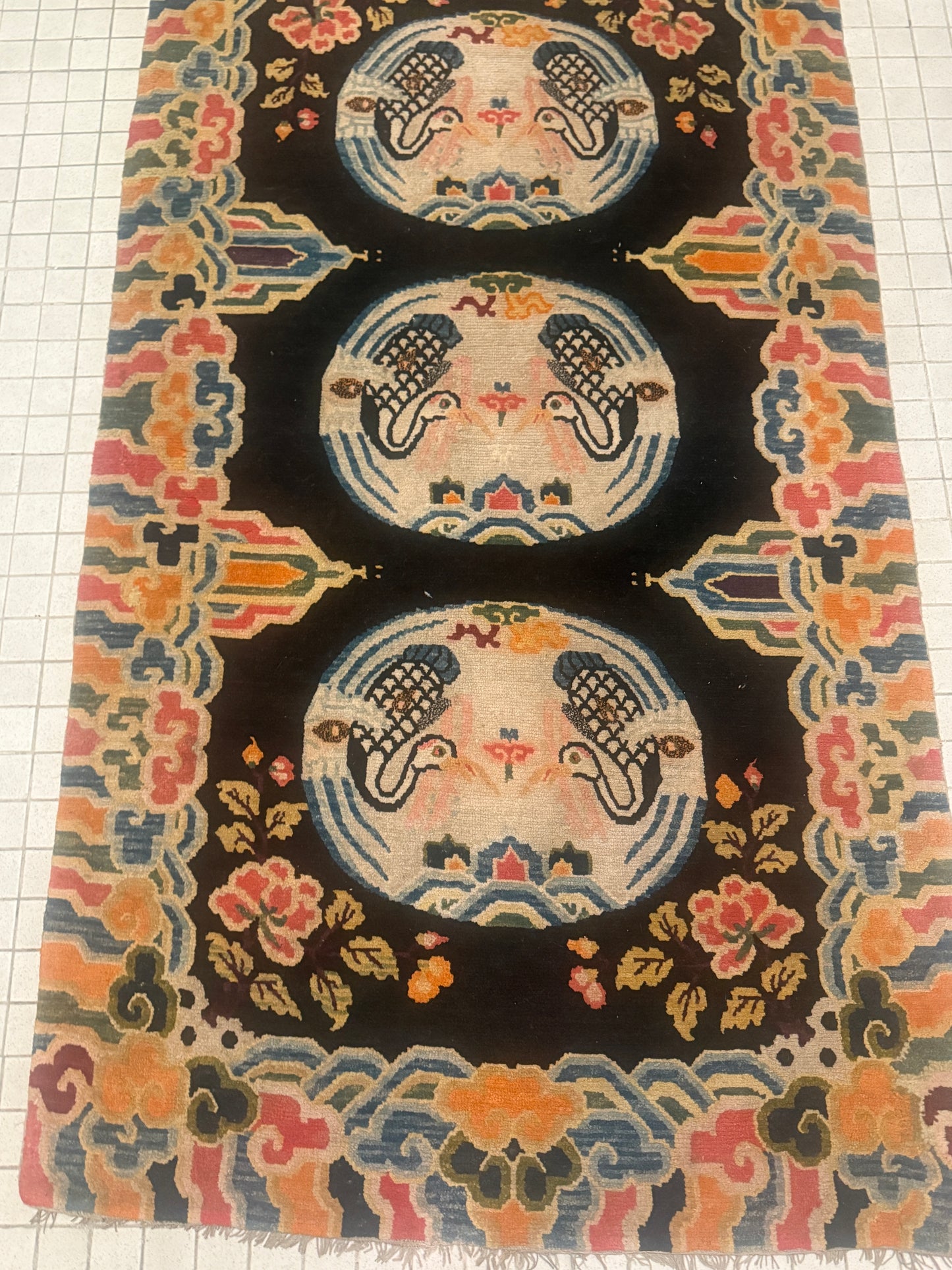 An antique early 20th c., Tibetan rug