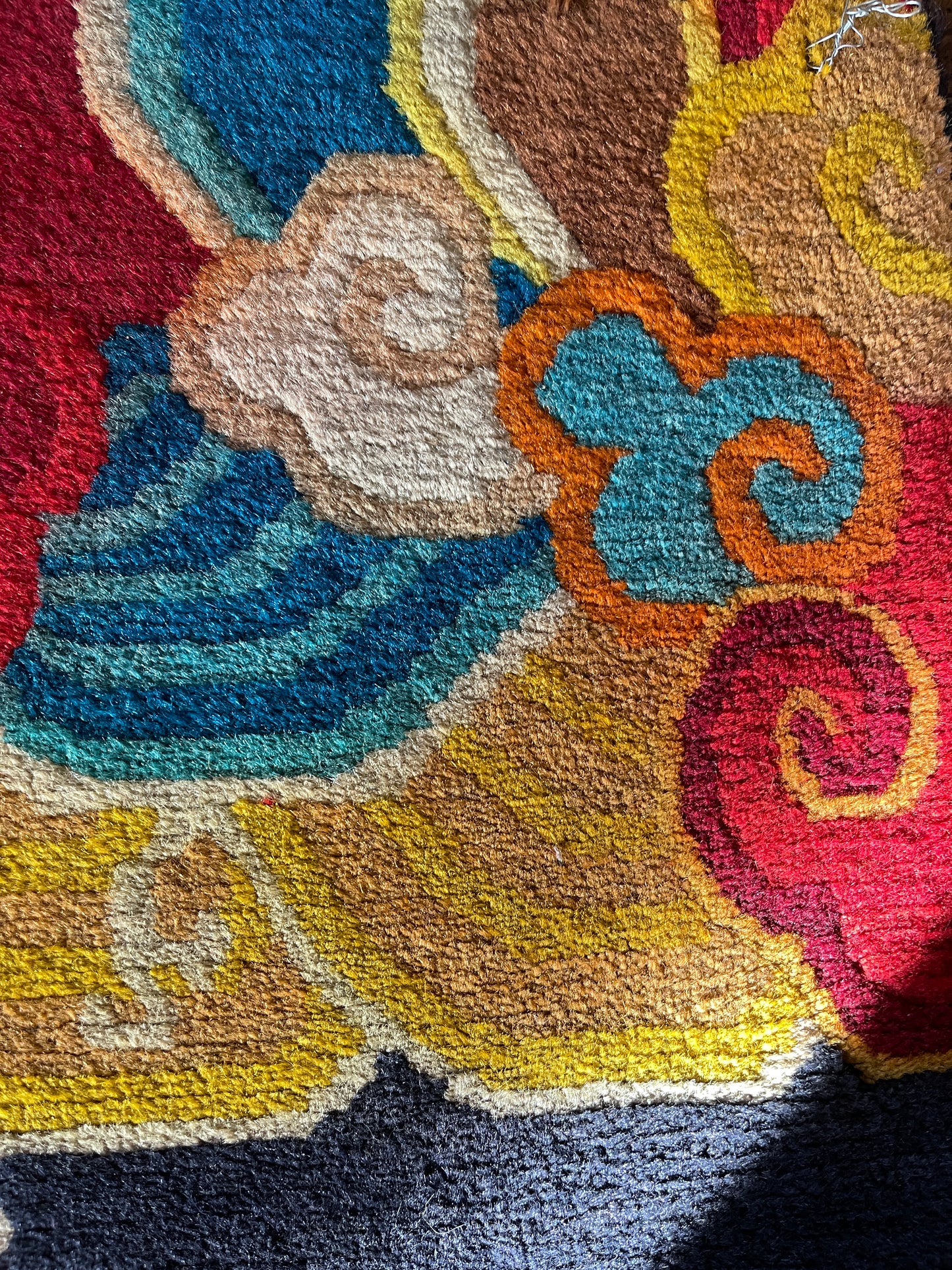 A vintage Tibetan rug featuring a dragon and phoenix