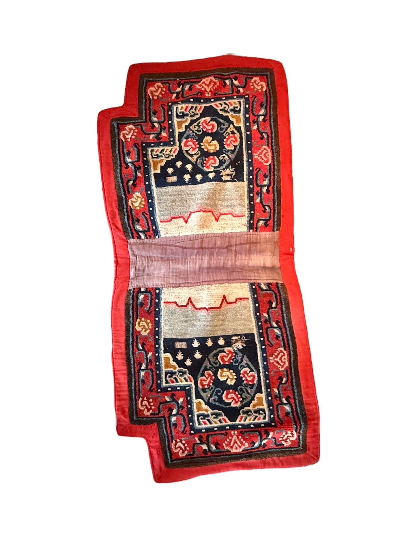 An antique Tibetan saddle rug and rug topper set