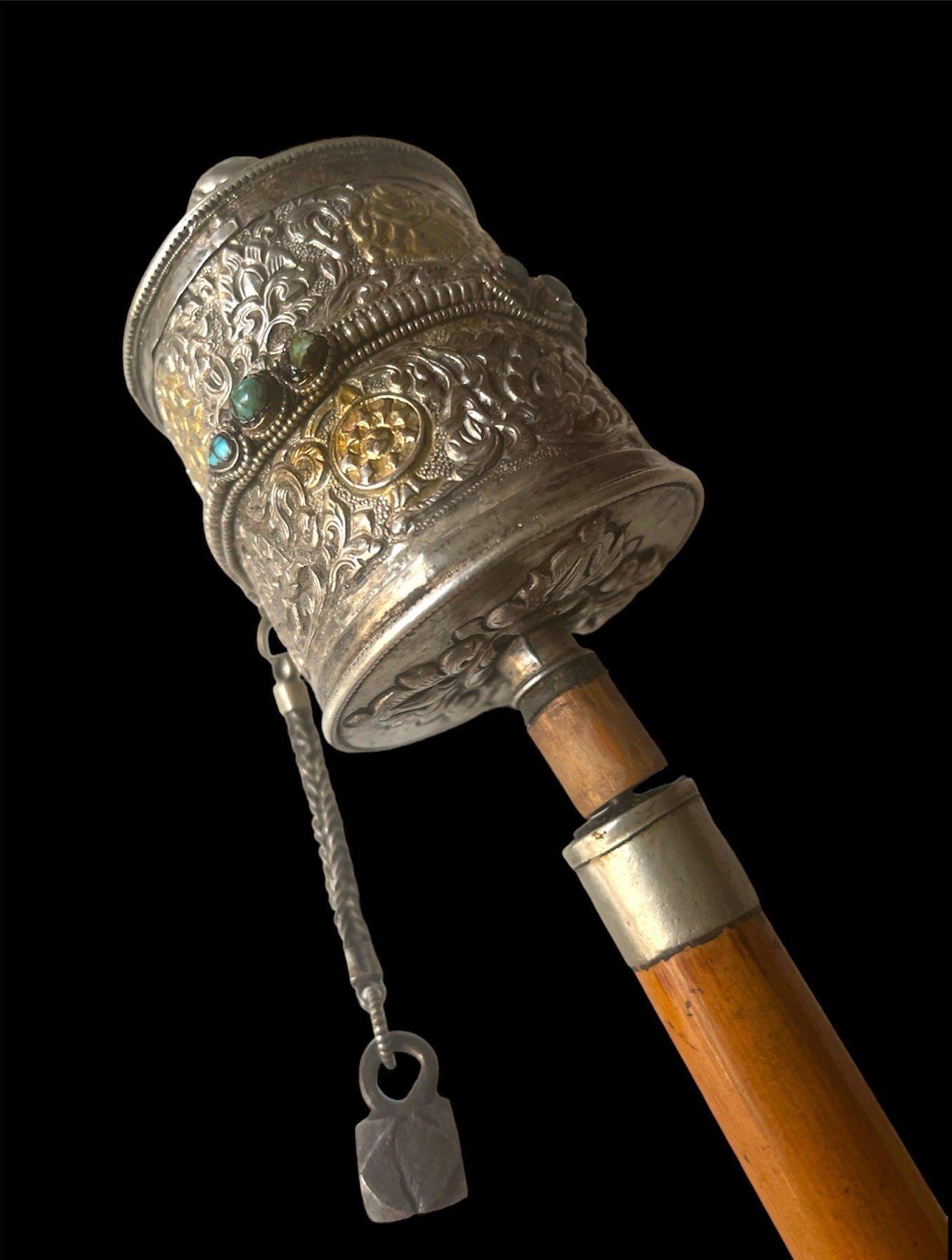 An antique Tibetan handheld prayer wheel