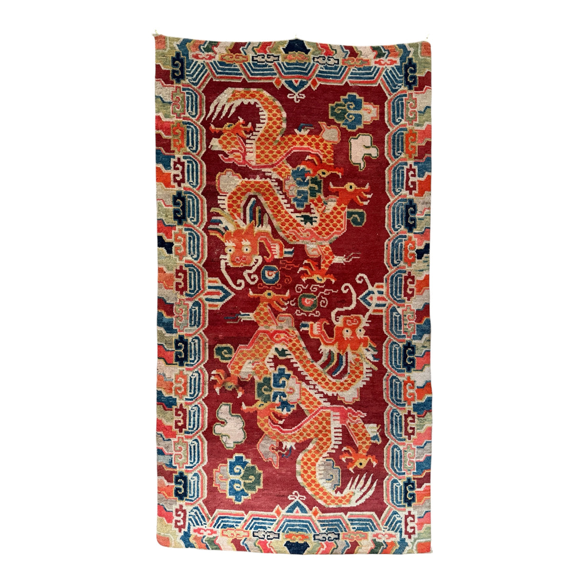 An early 20th C., antique Tibetan dragon rug
