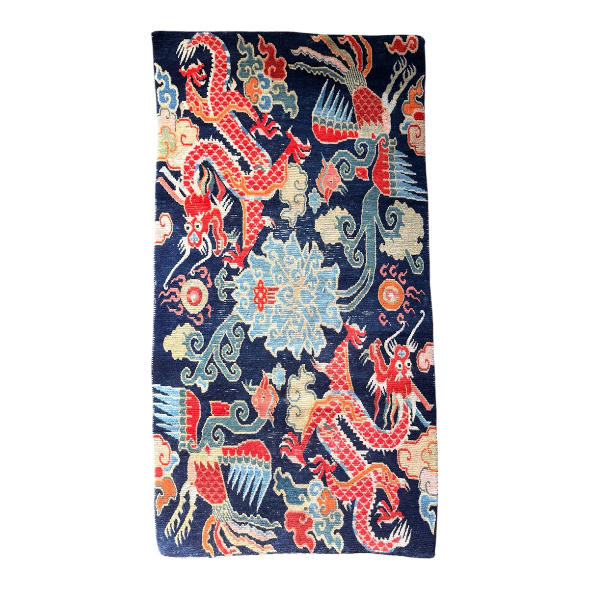 A mid 20th C., Tibetan dragon and phoenix rug