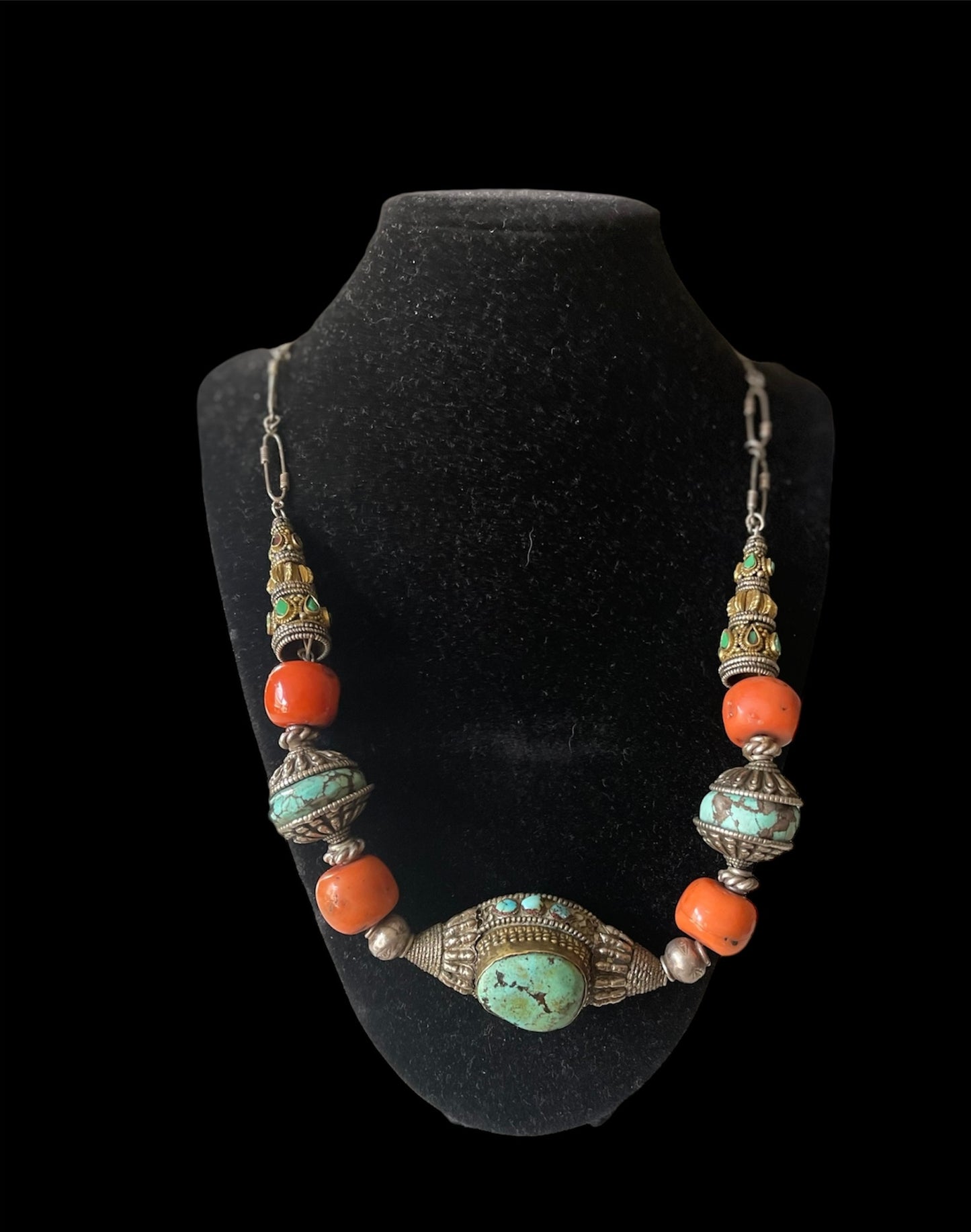 A necklace with antique Tibetan silver beads and coral