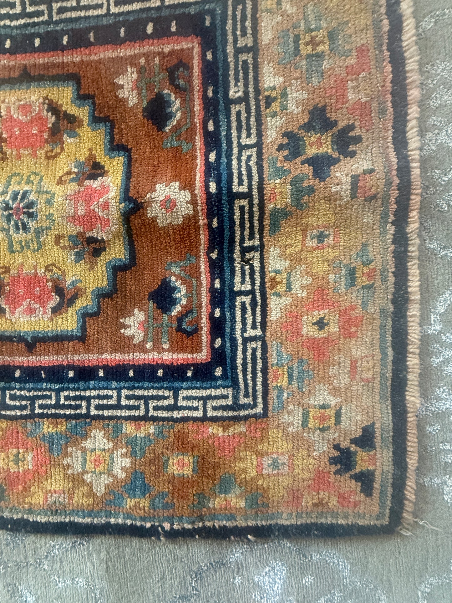 Antique meditation seat rug