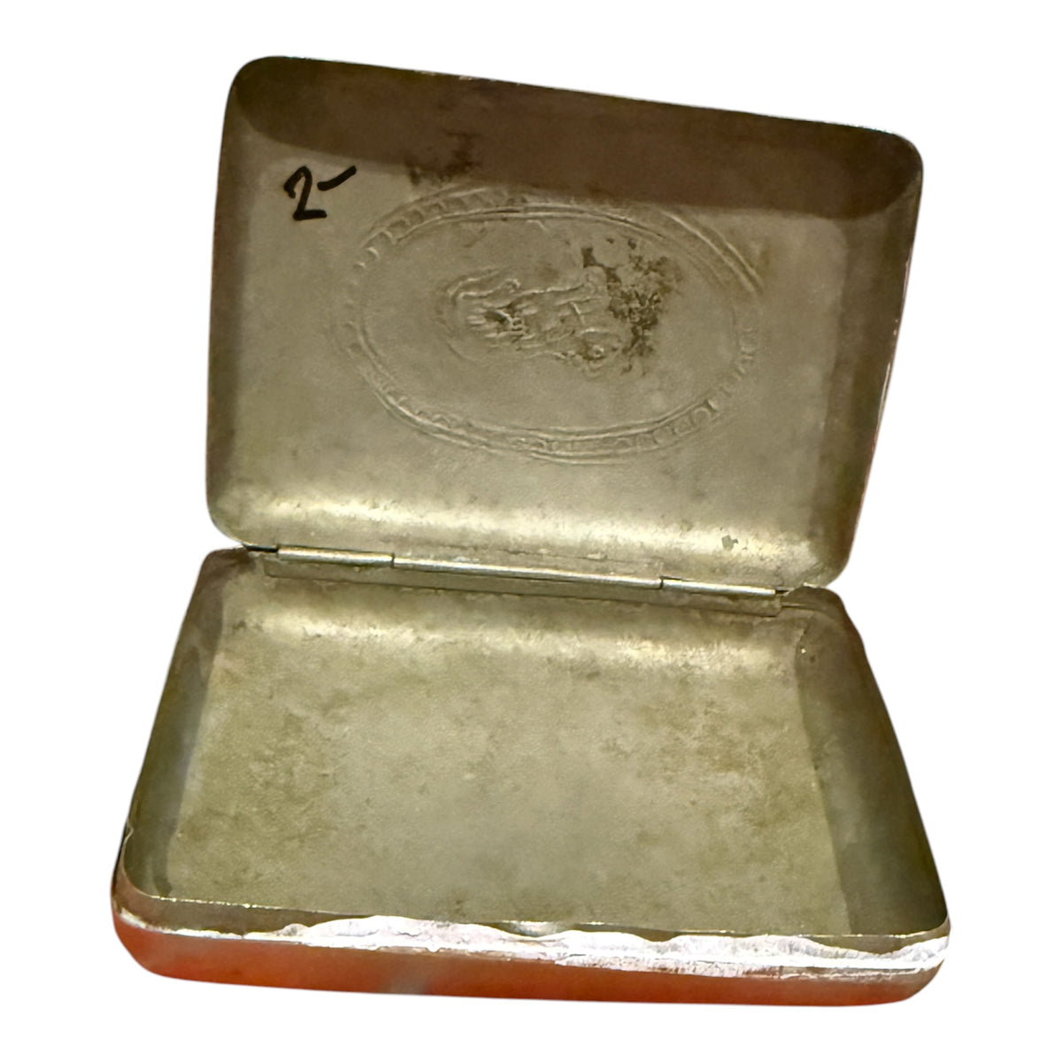 A silver box with hinged lid