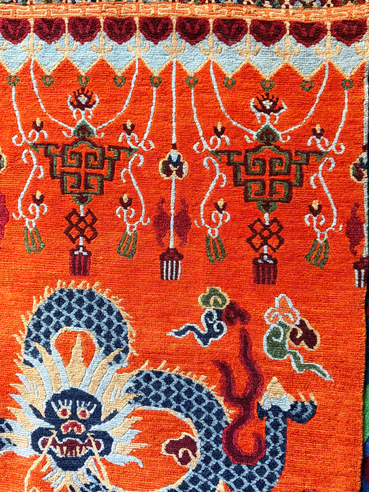 A vintage Tibetan dragon door rug