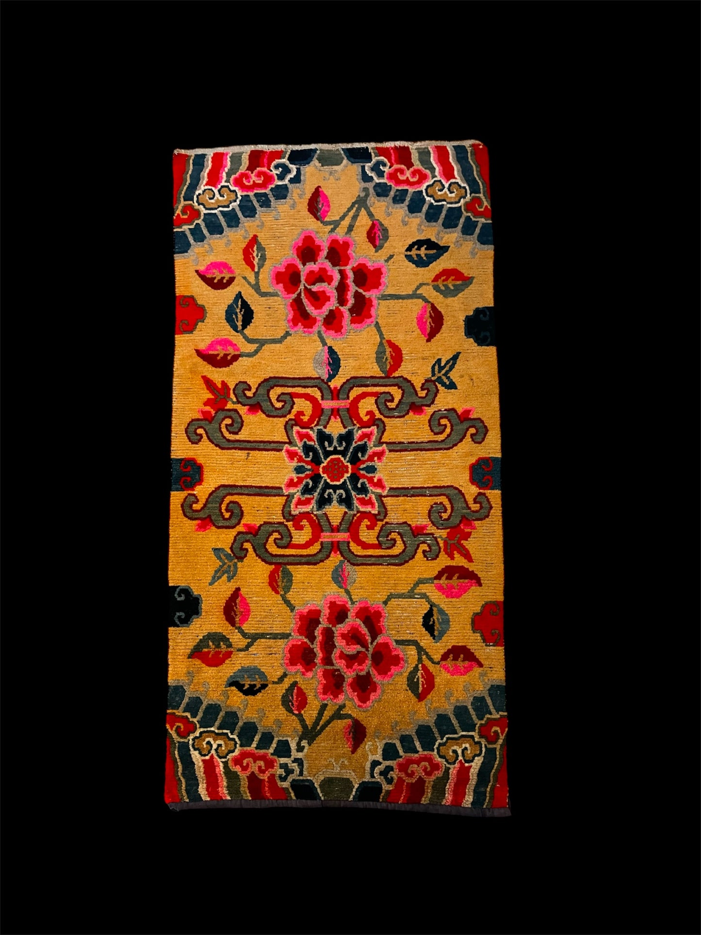 An early 20th C., antique Tibetan floral rug