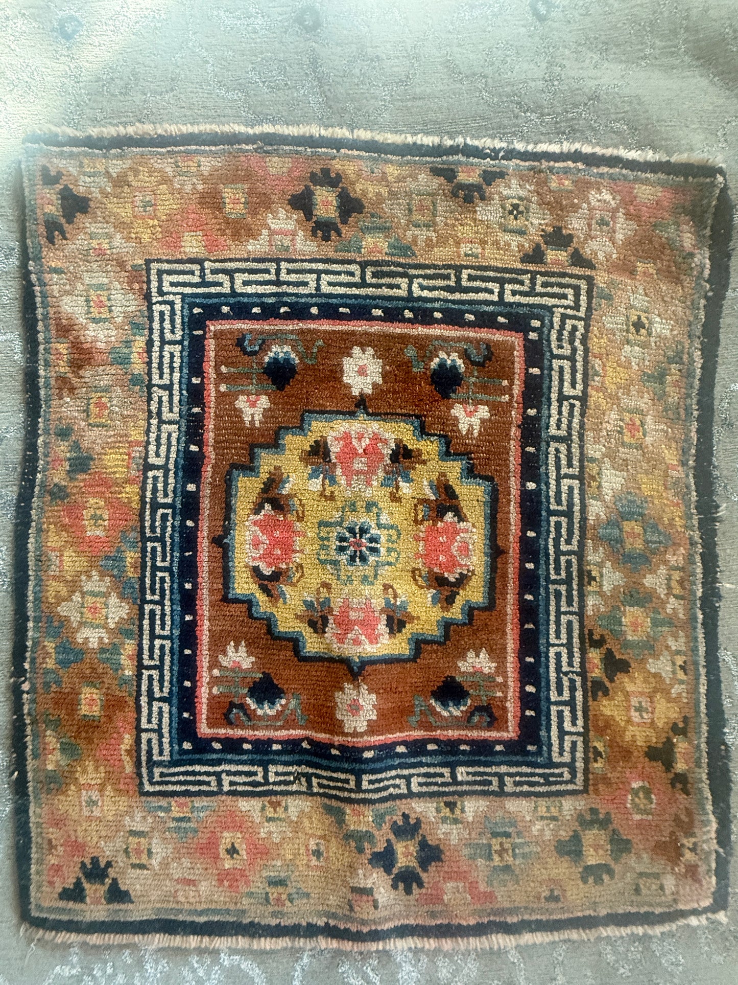 Antique meditation seat rug