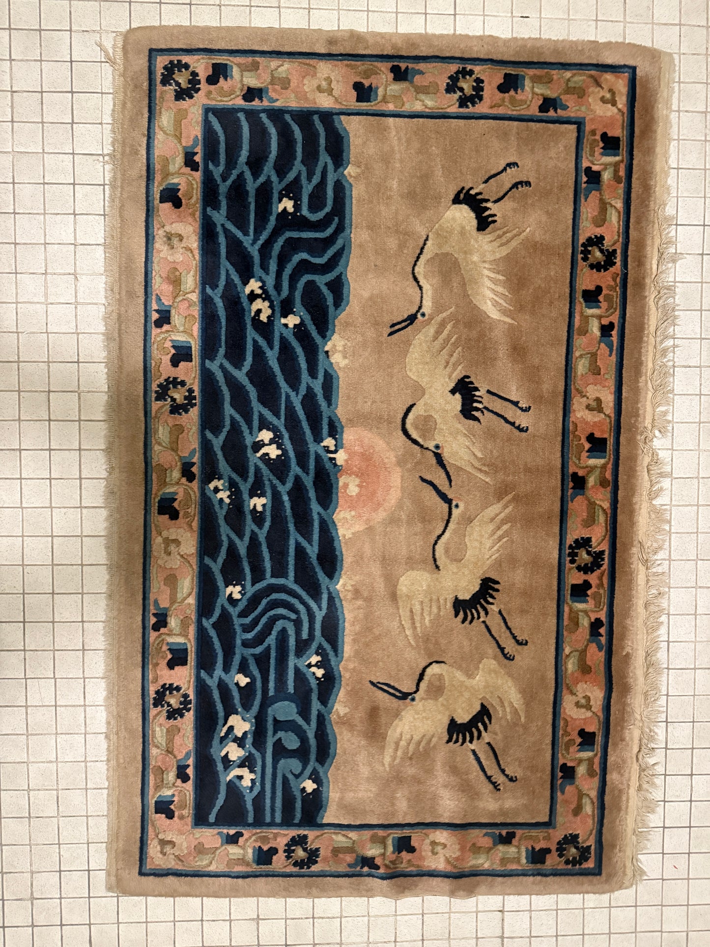 An antique Chinese pictorial rug