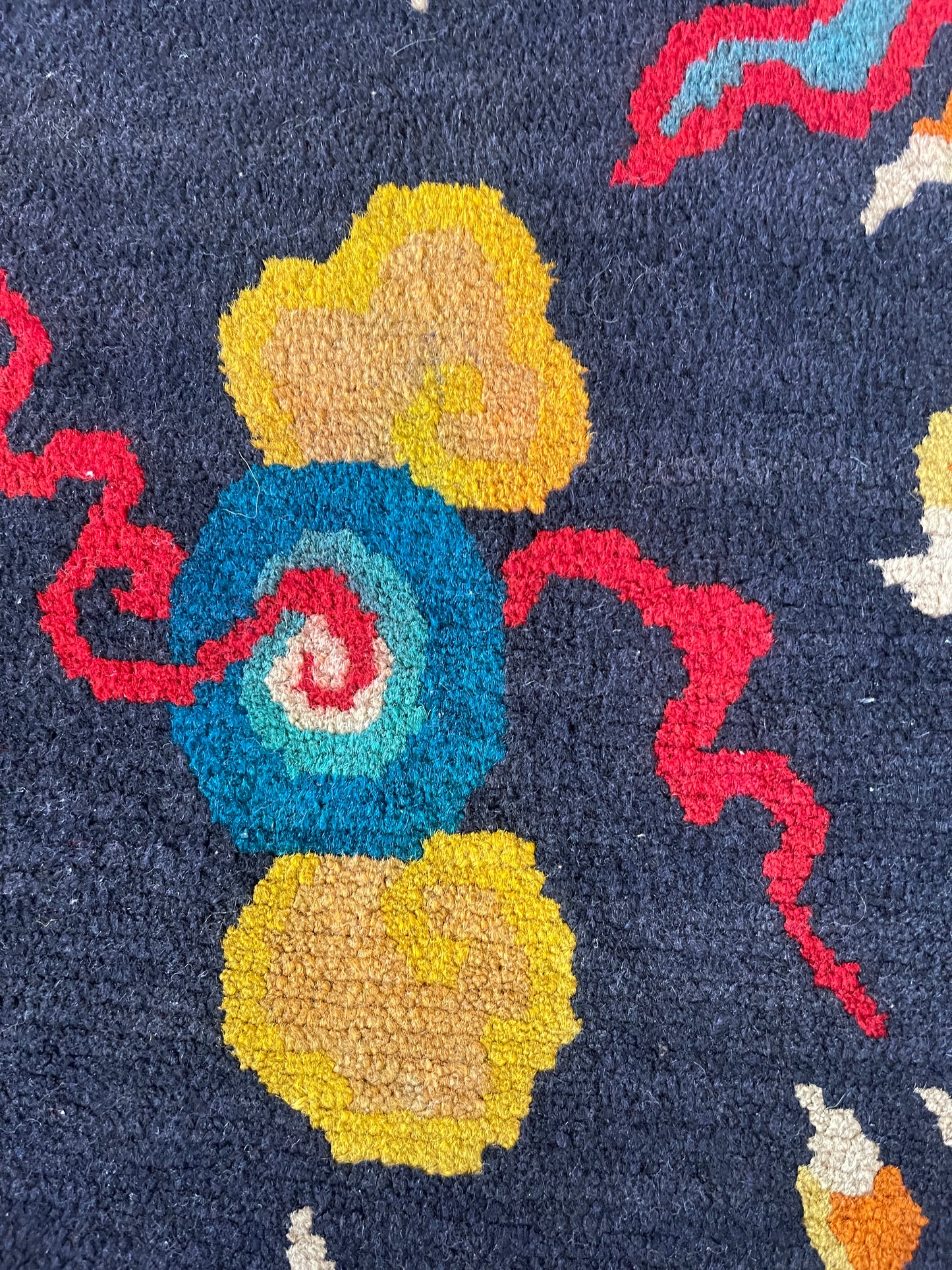 A vintage Tibetan rug featuring a dragon and phoenix