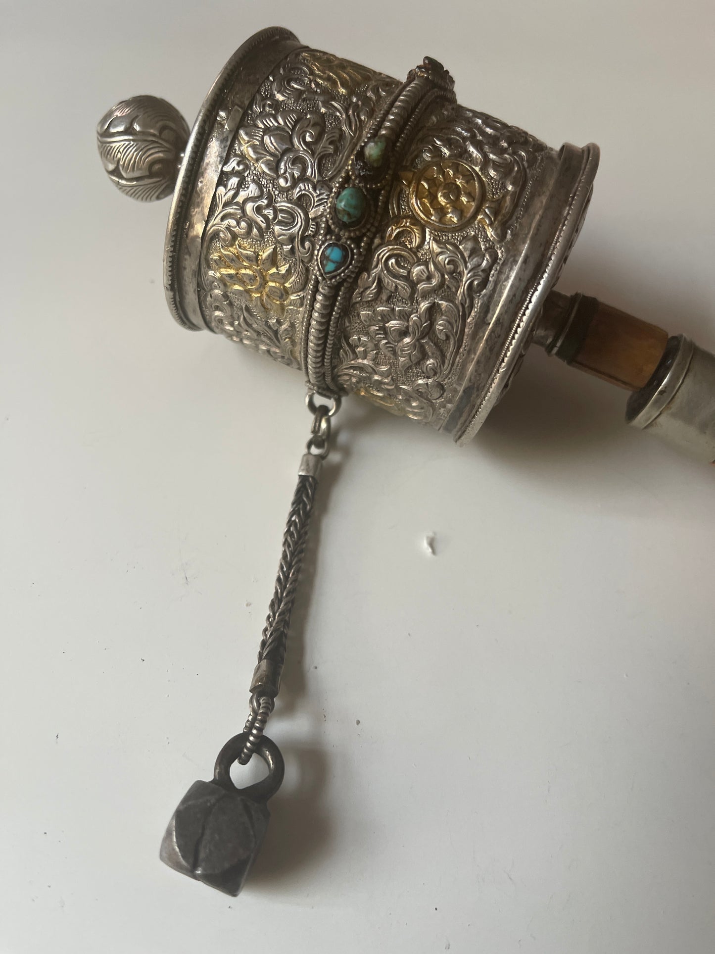 An antique Tibetan handheld prayer wheel