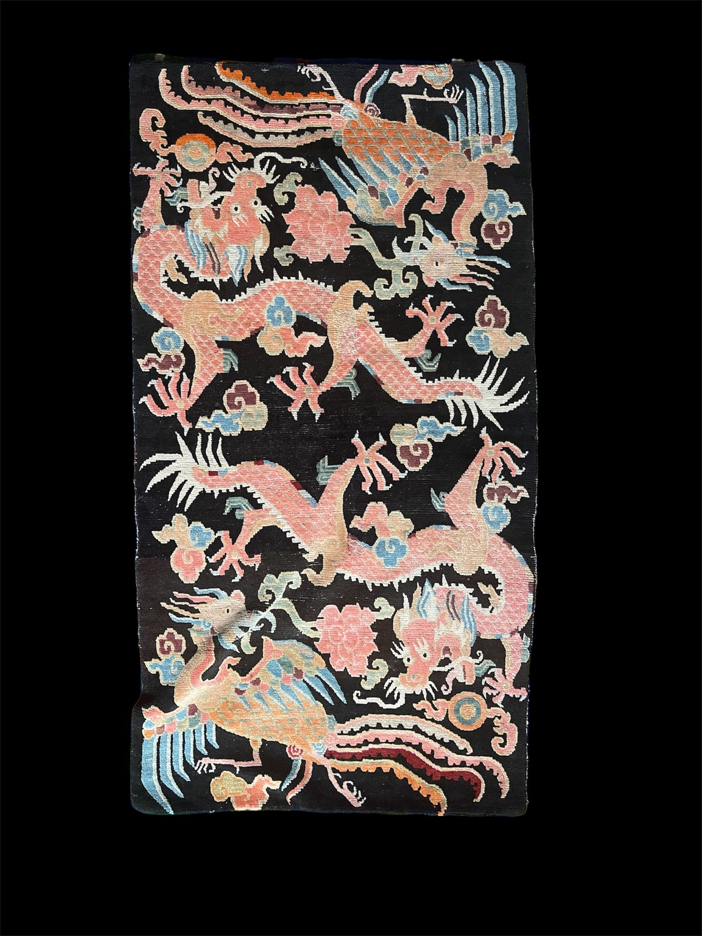 A mid 20th C., Tibetan dragon and phoenix rug