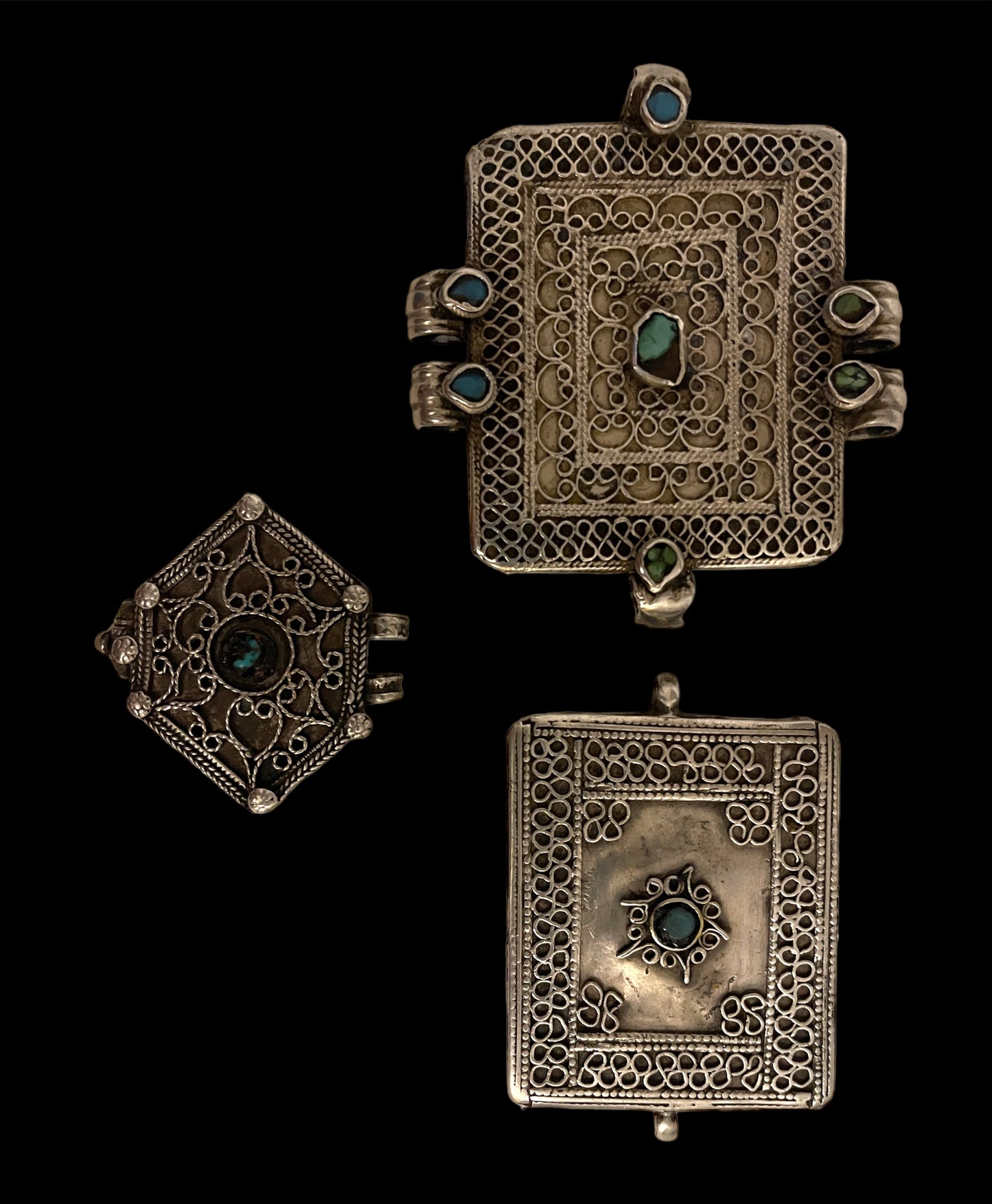 A set of three antique silver amulet boxes