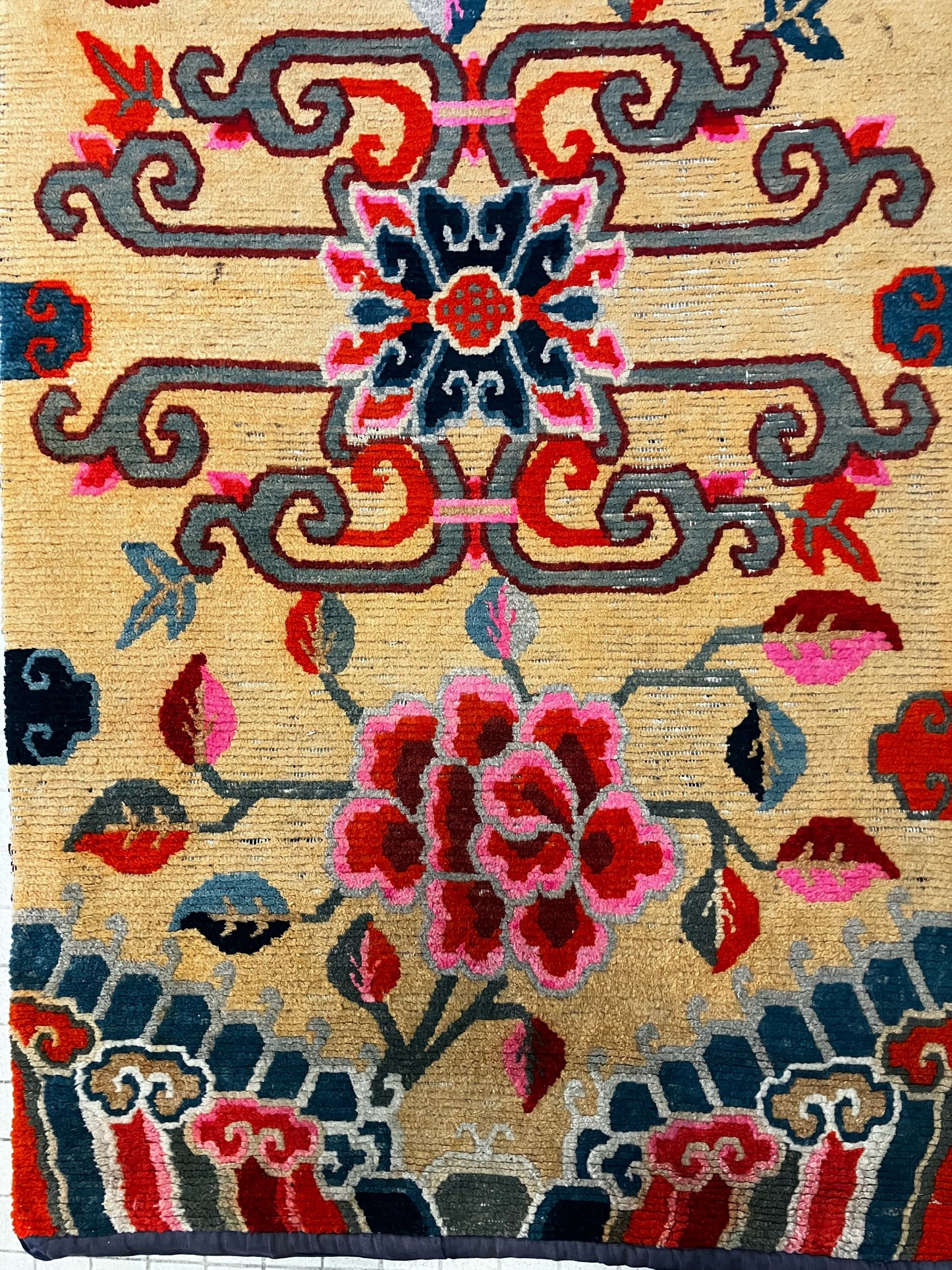 An early 20th C., antique Tibetan floral rug