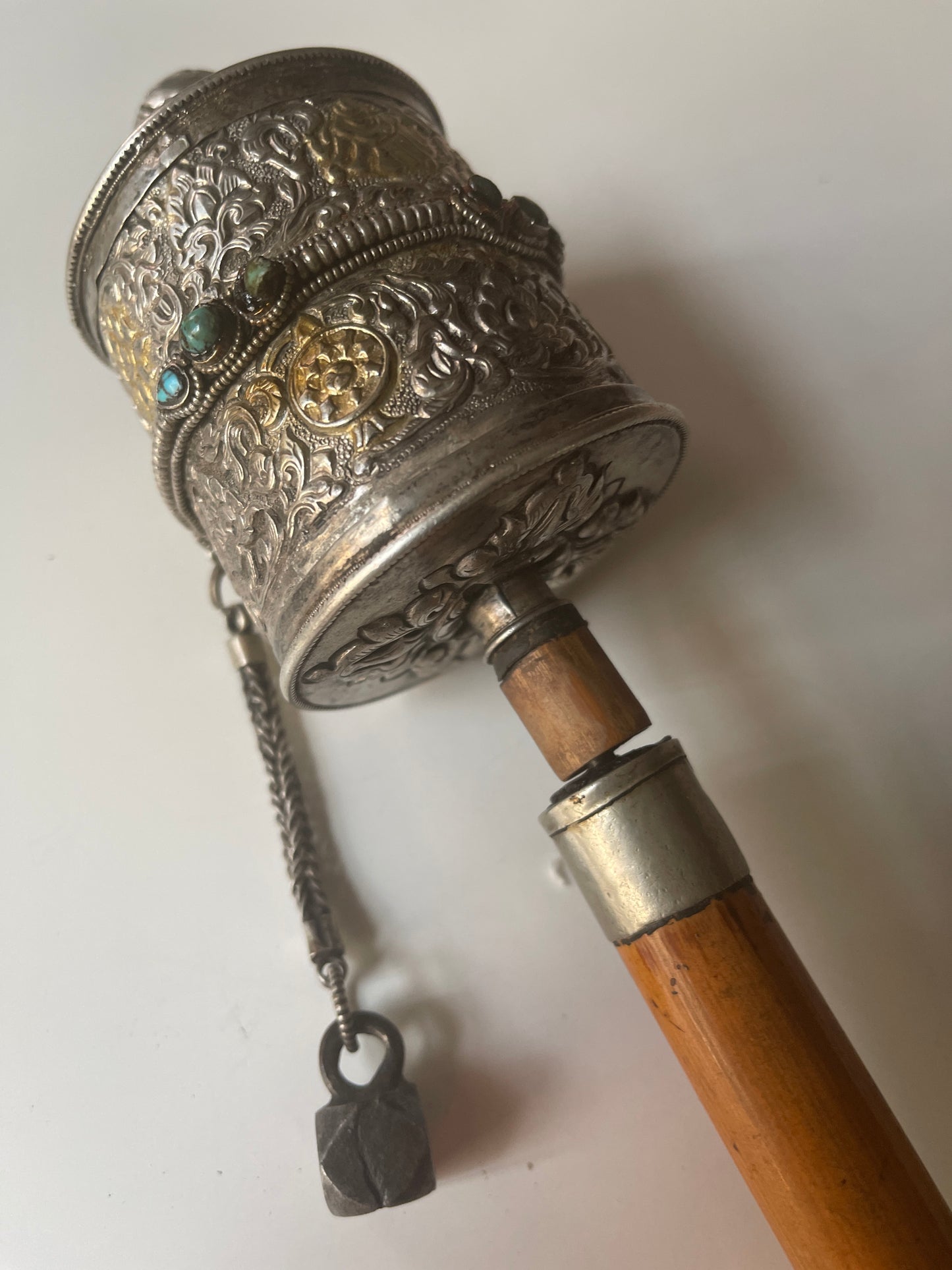 An antique Tibetan handheld prayer wheel
