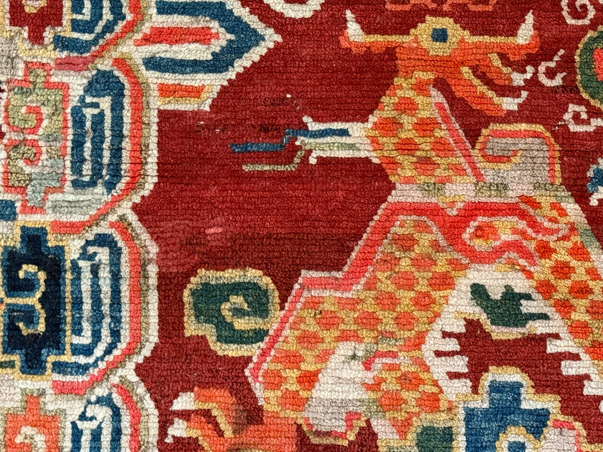 An early 20th C., antique Tibetan dragon rug