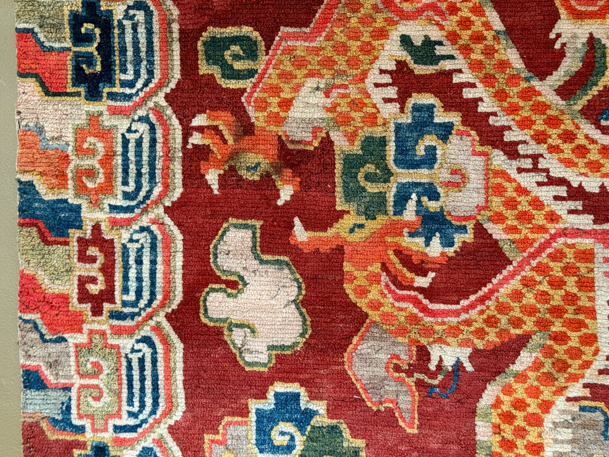 An early 20th C., antique Tibetan dragon rug