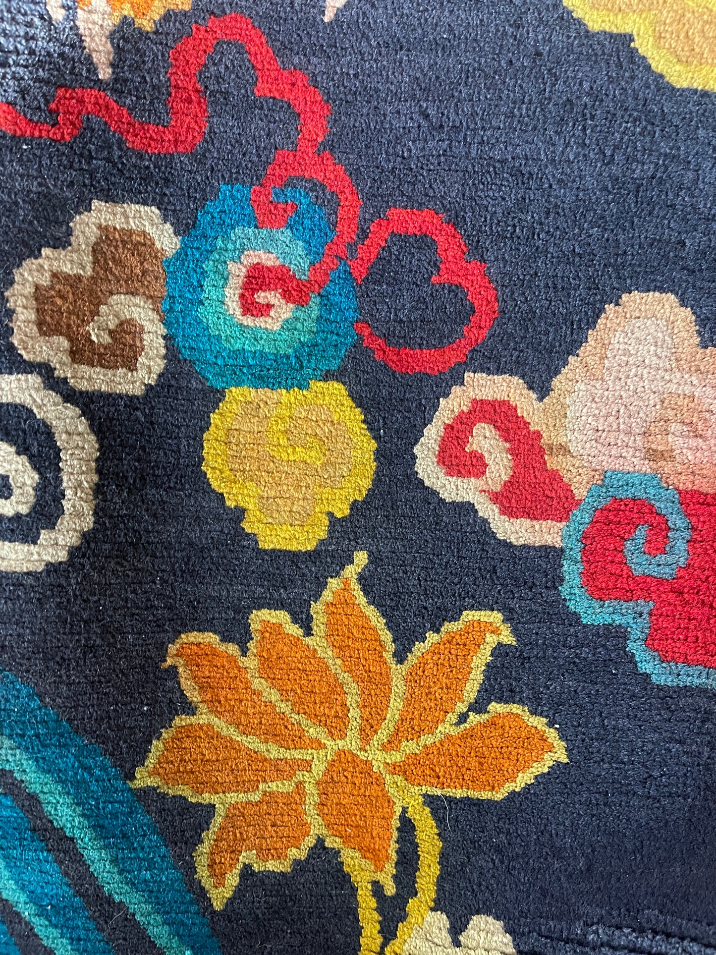 A vintage Tibetan rug featuring a dragon and phoenix