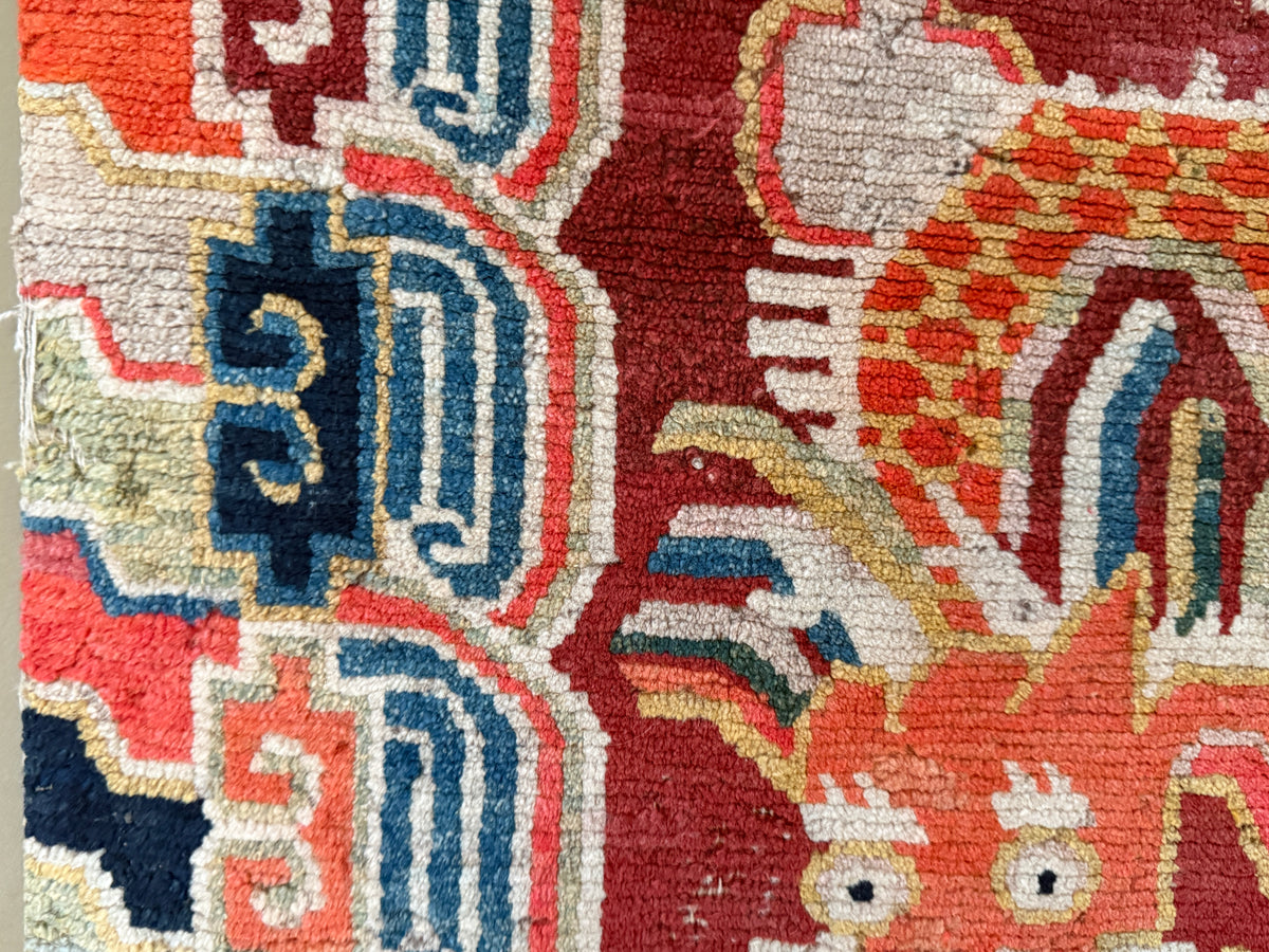 An early 20th C., antique Tibetan dragon rug