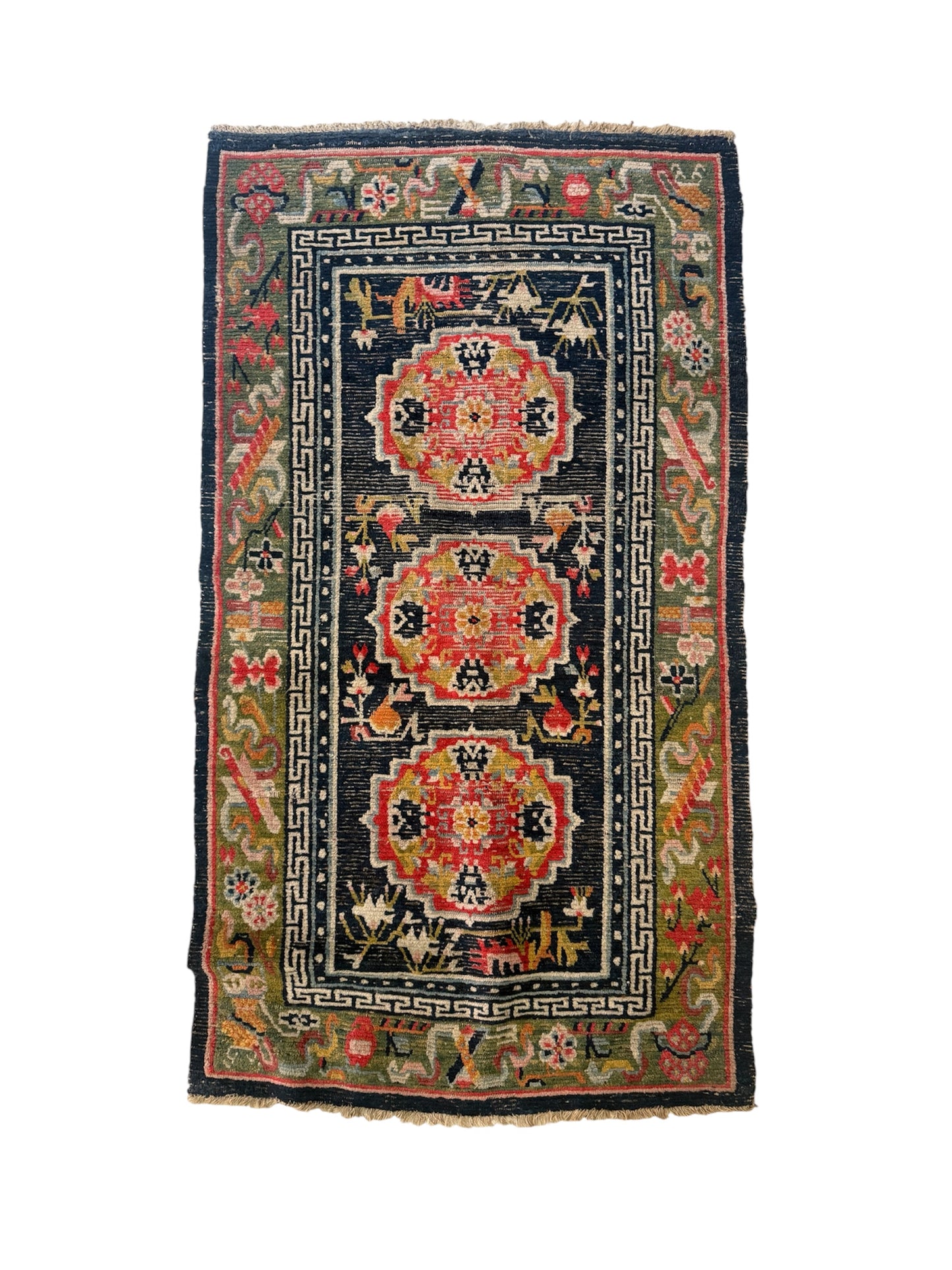 An antique Tibetan residential rug with medallions