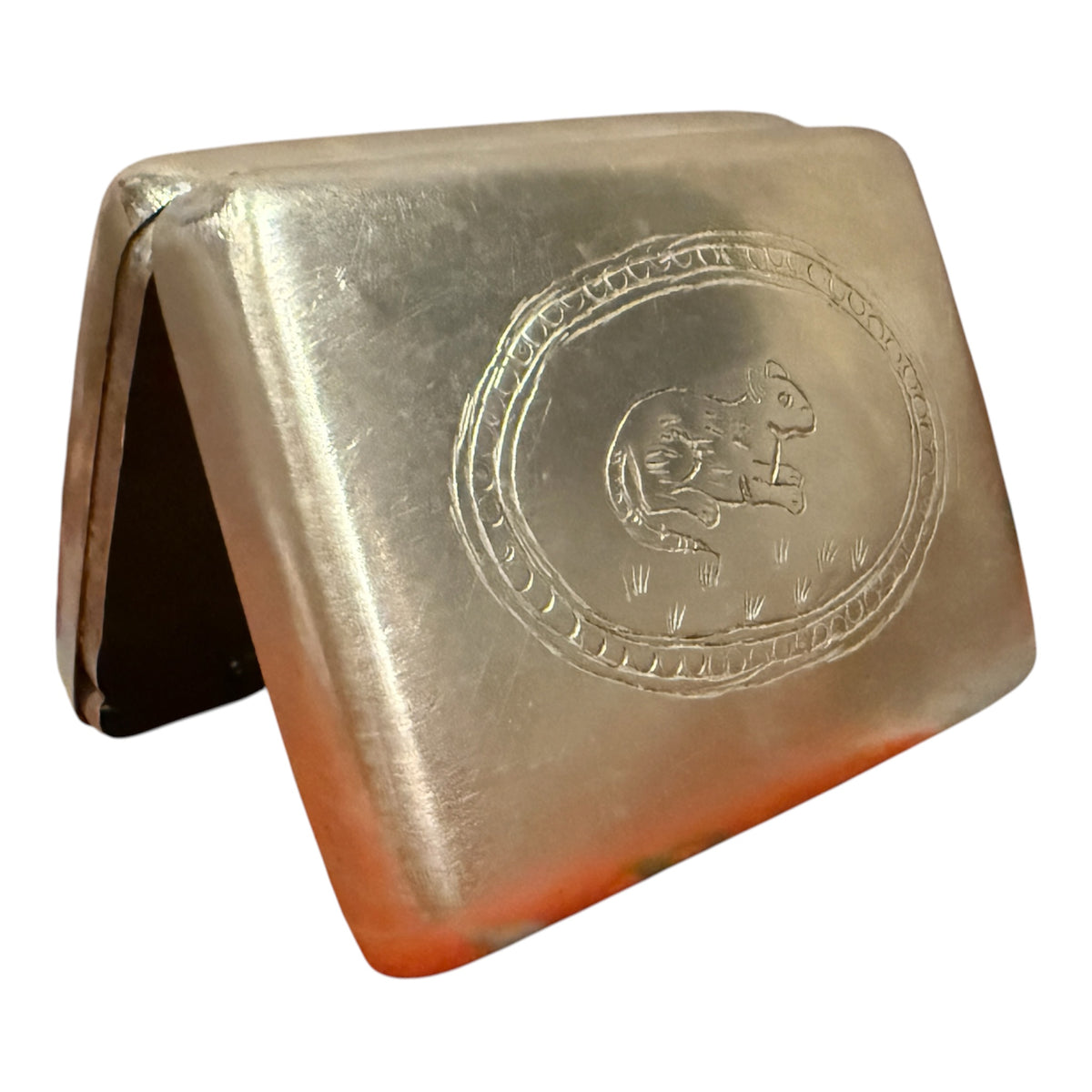 A silver box with hinged lid