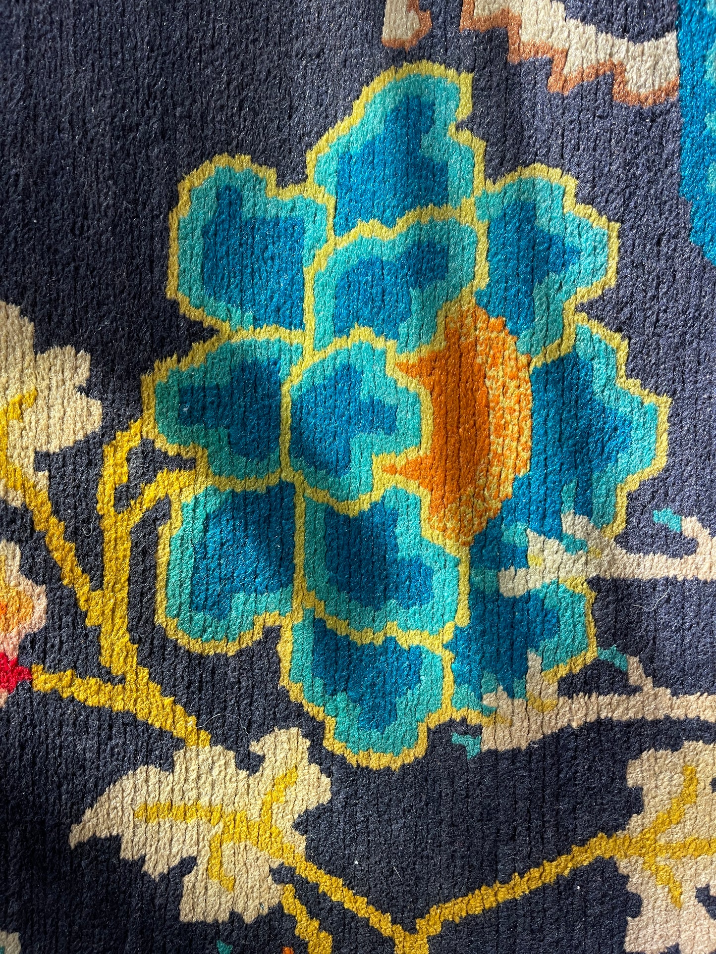 A vintage Tibetan rug featuring a dragon and phoenix