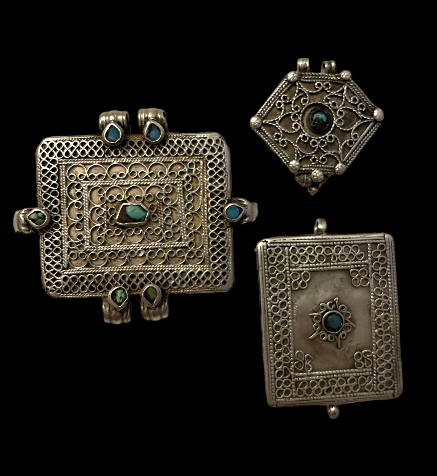 A set of three antique silver amulet boxes