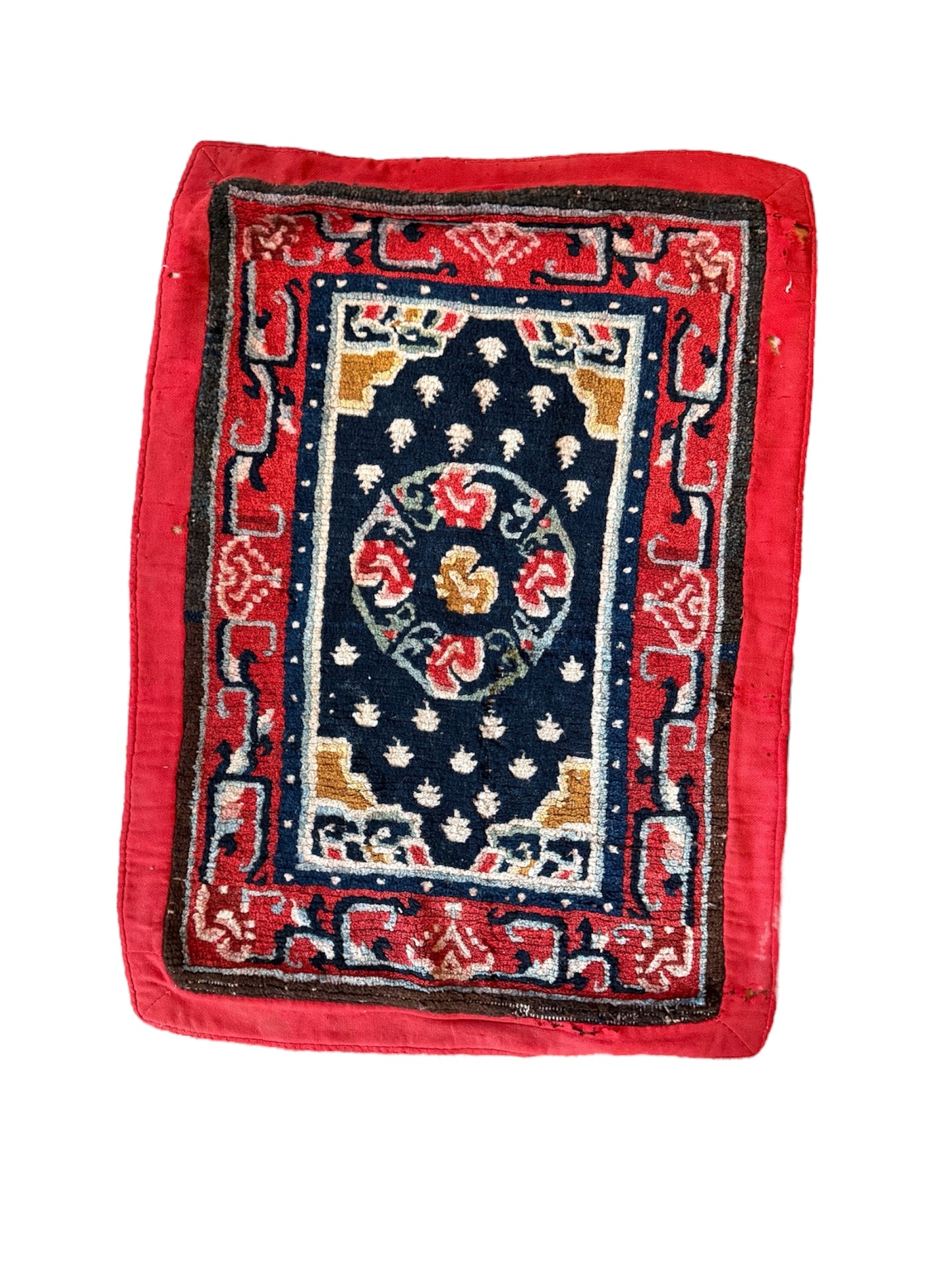 An antique Tibetan saddle rug and rug topper set