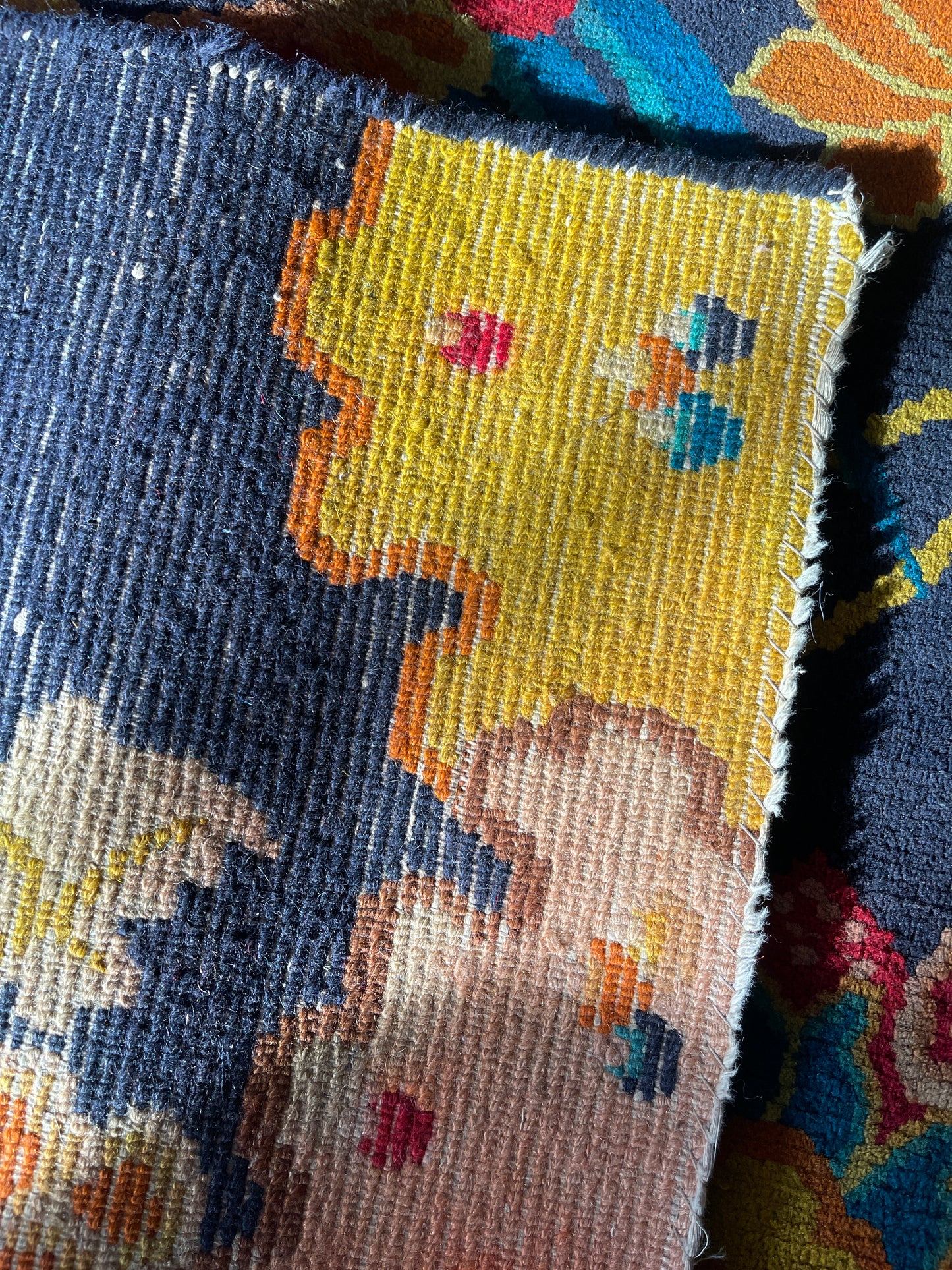 A vintage Tibetan rug featuring a dragon and phoenix
