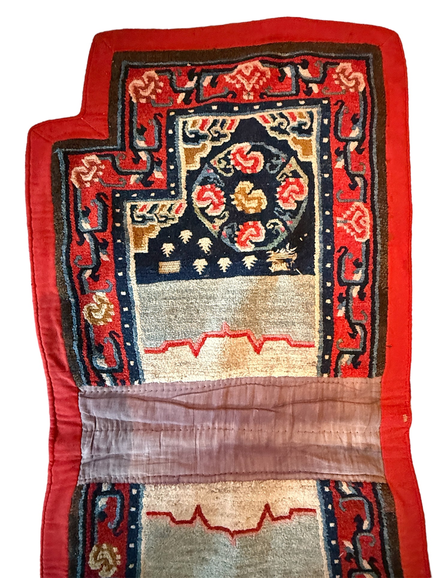 An antique Tibetan saddle rug and rug topper set