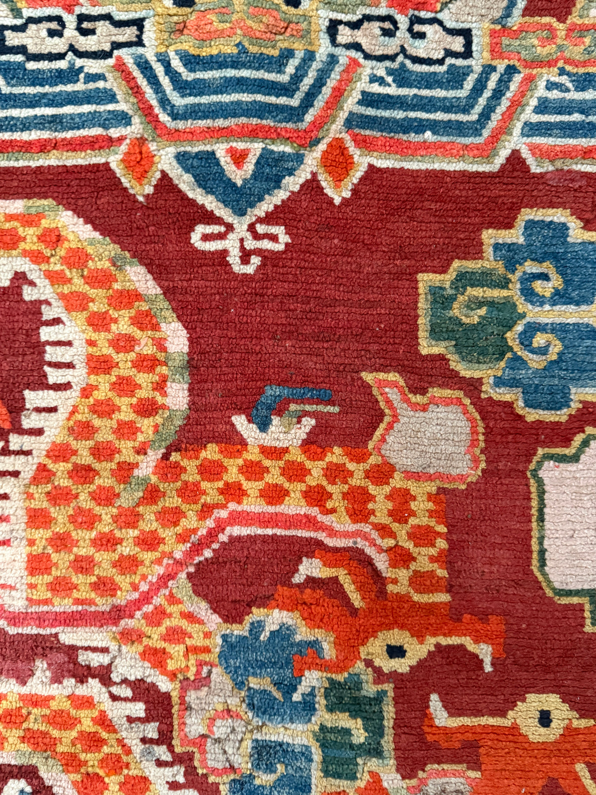 An early 20th C., antique Tibetan dragon rug