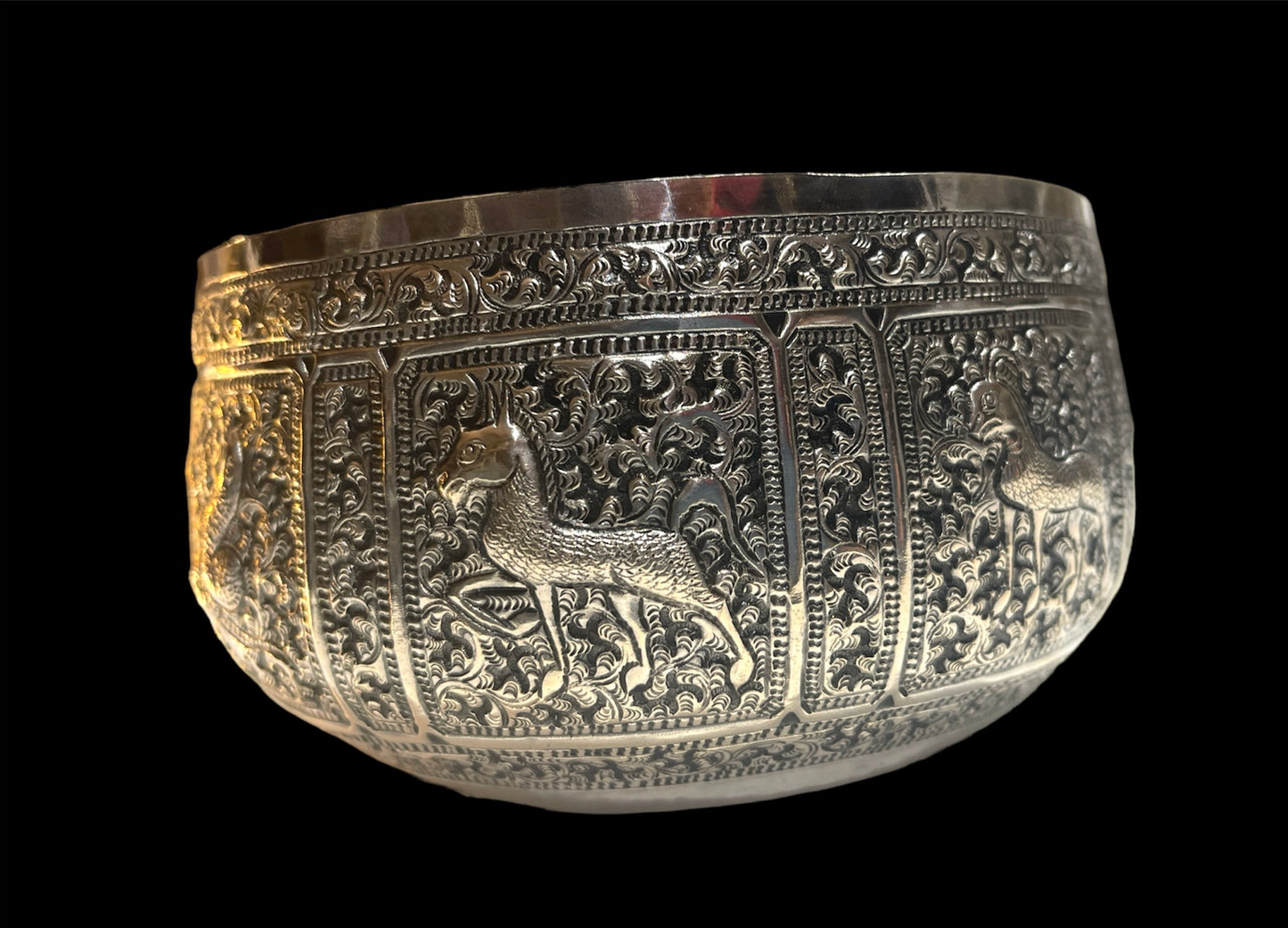 An antique south East Asian silver repousse bowl