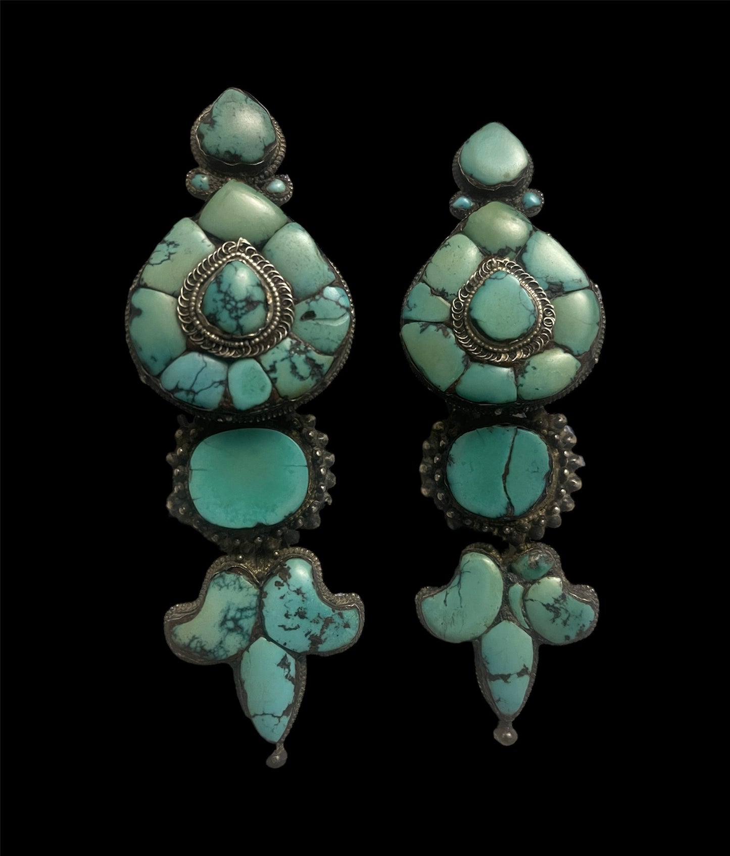 A pair of antique Tibetan turquoise and silver ear pendants