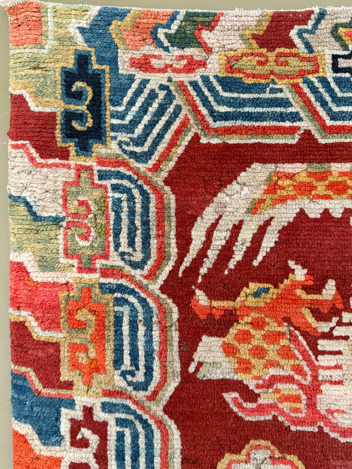 An early 20th C., antique Tibetan dragon rug