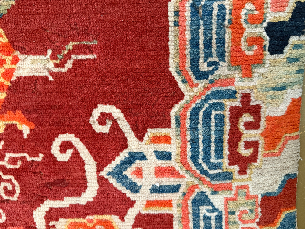 An early 20th C., antique Tibetan dragon rug