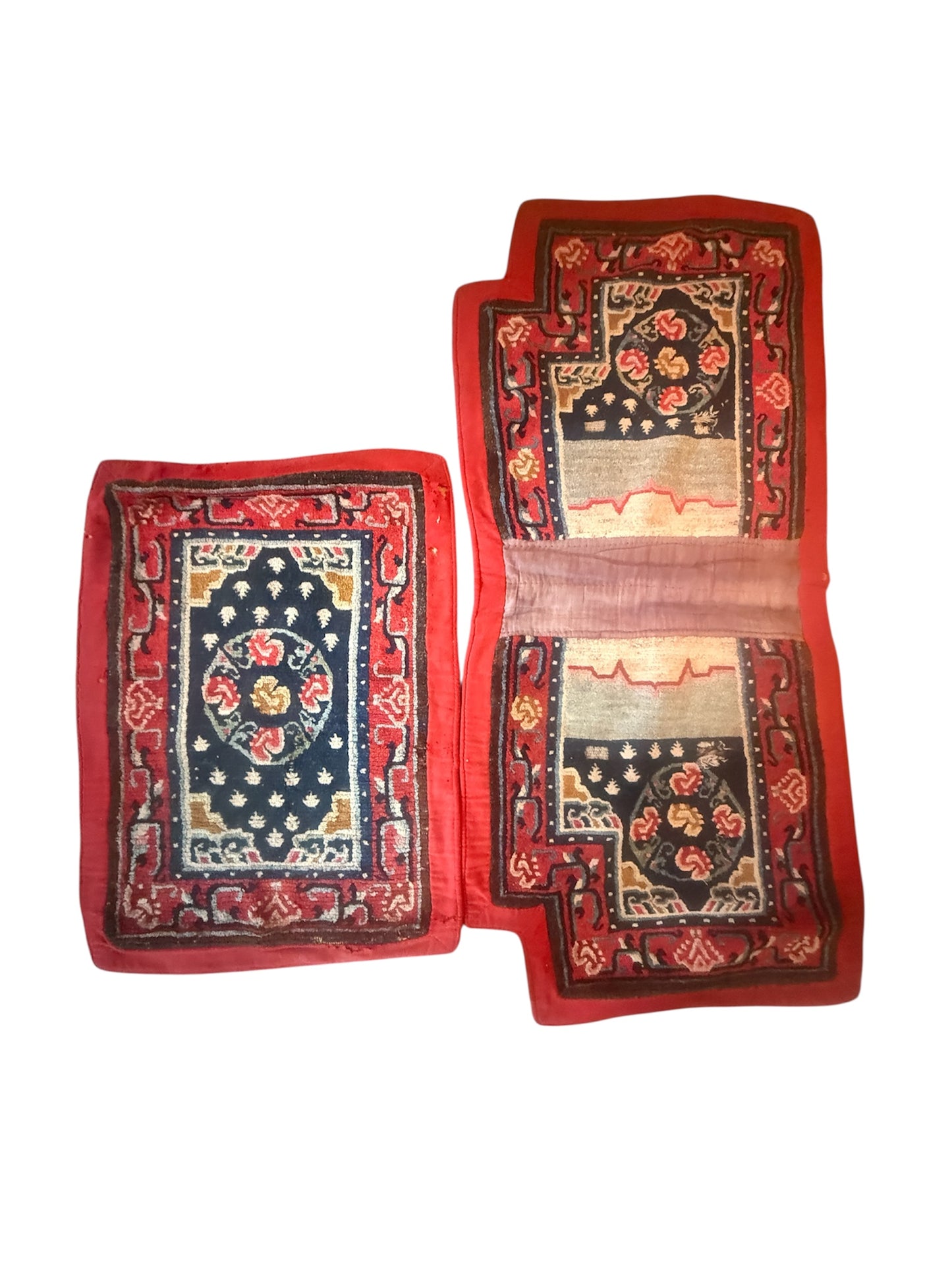 An antique Tibetan saddle rug and rug topper set