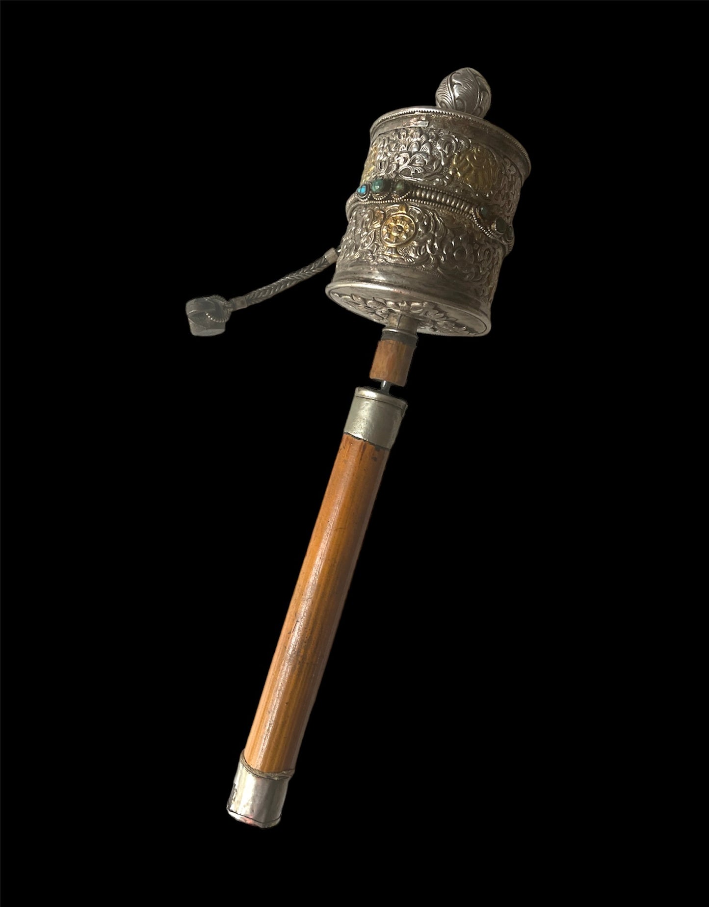 An antique Tibetan handheld prayer wheel