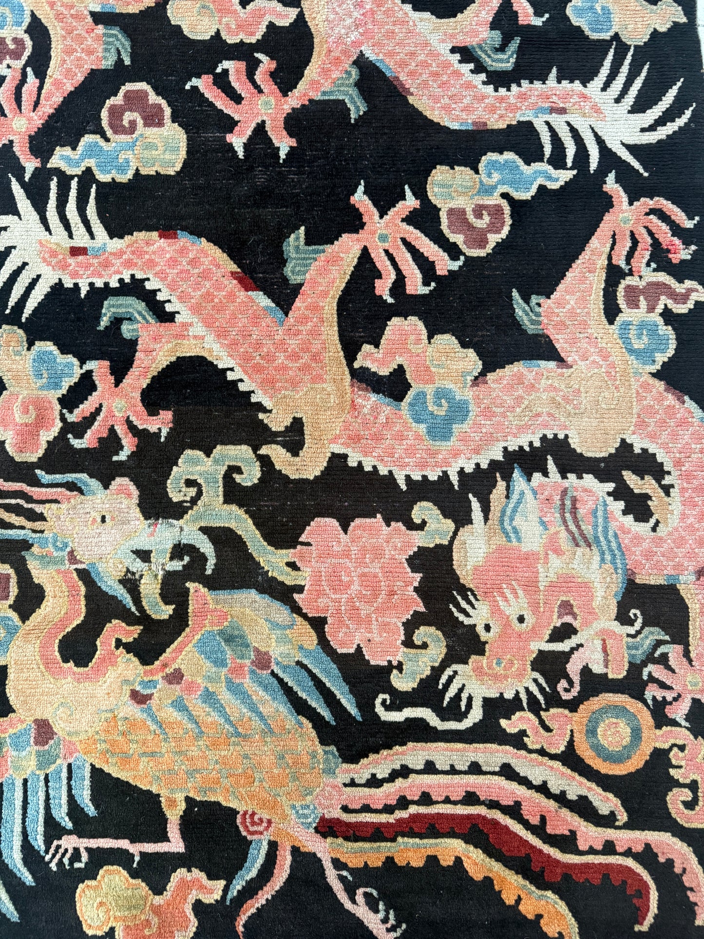 A mid 20th C., Tibetan dragon and phoenix rug