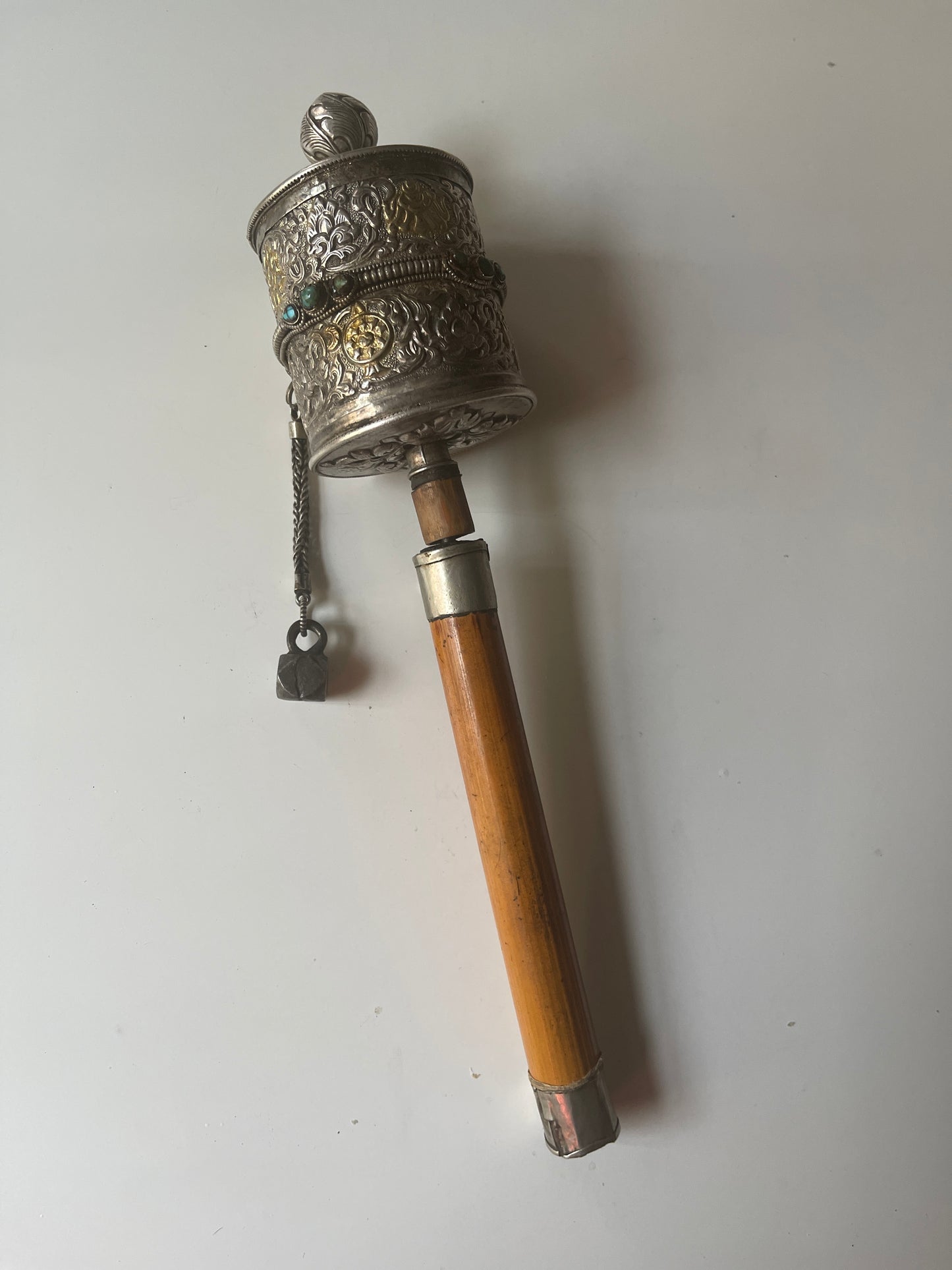 An antique Tibetan handheld prayer wheel