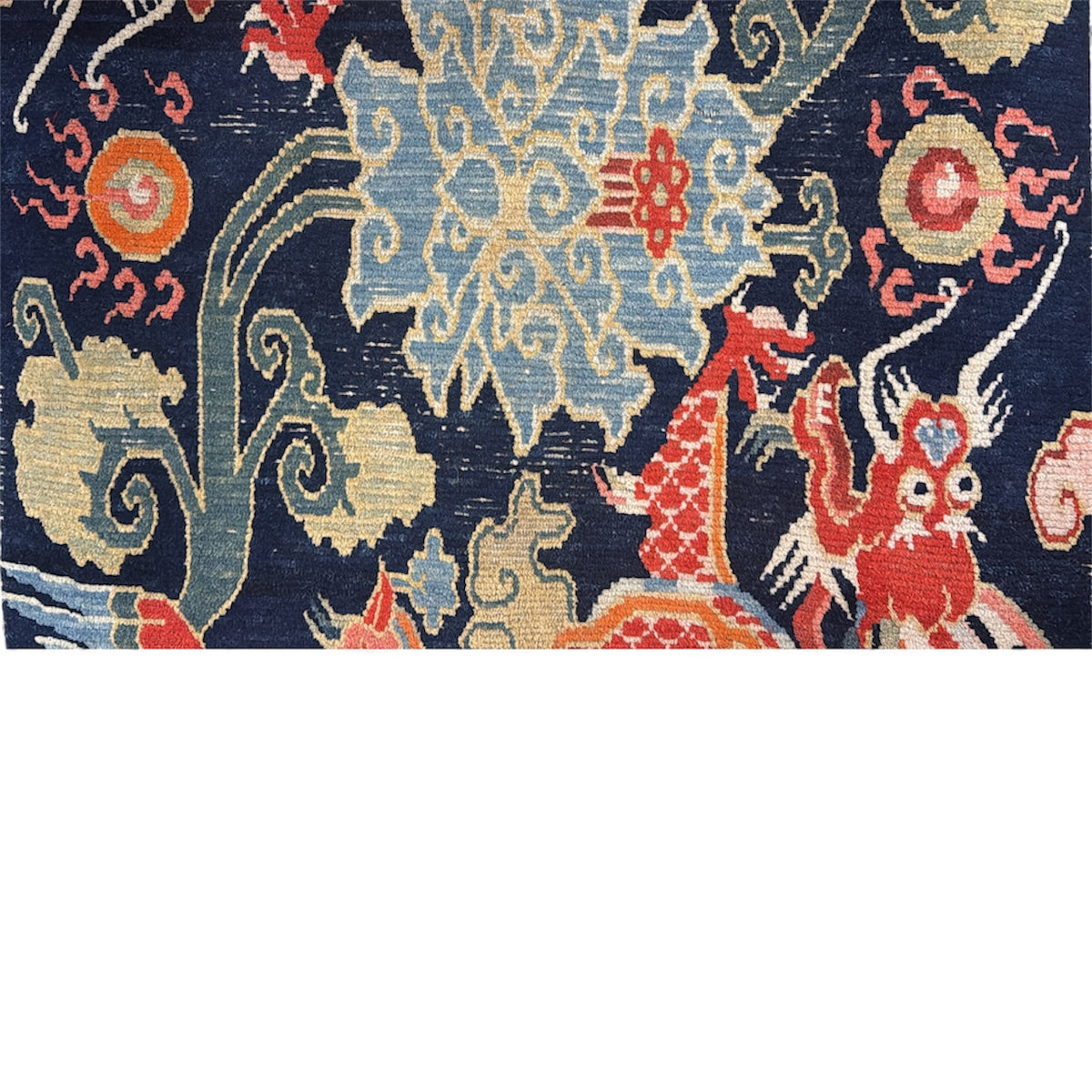 A mid 20th C., Tibetan dragon and phoenix rug