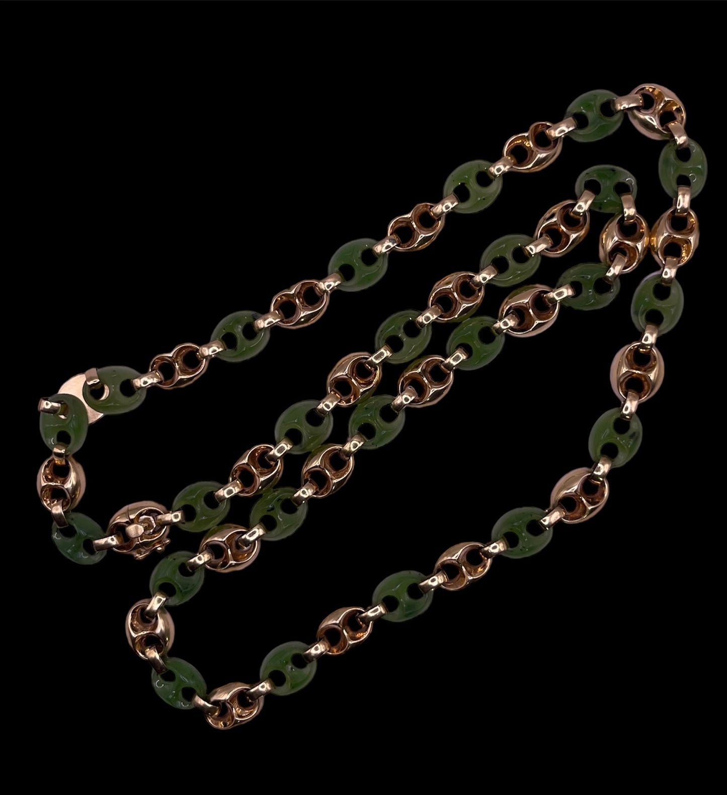 A carved nephrite jade and 14kt gold necklace