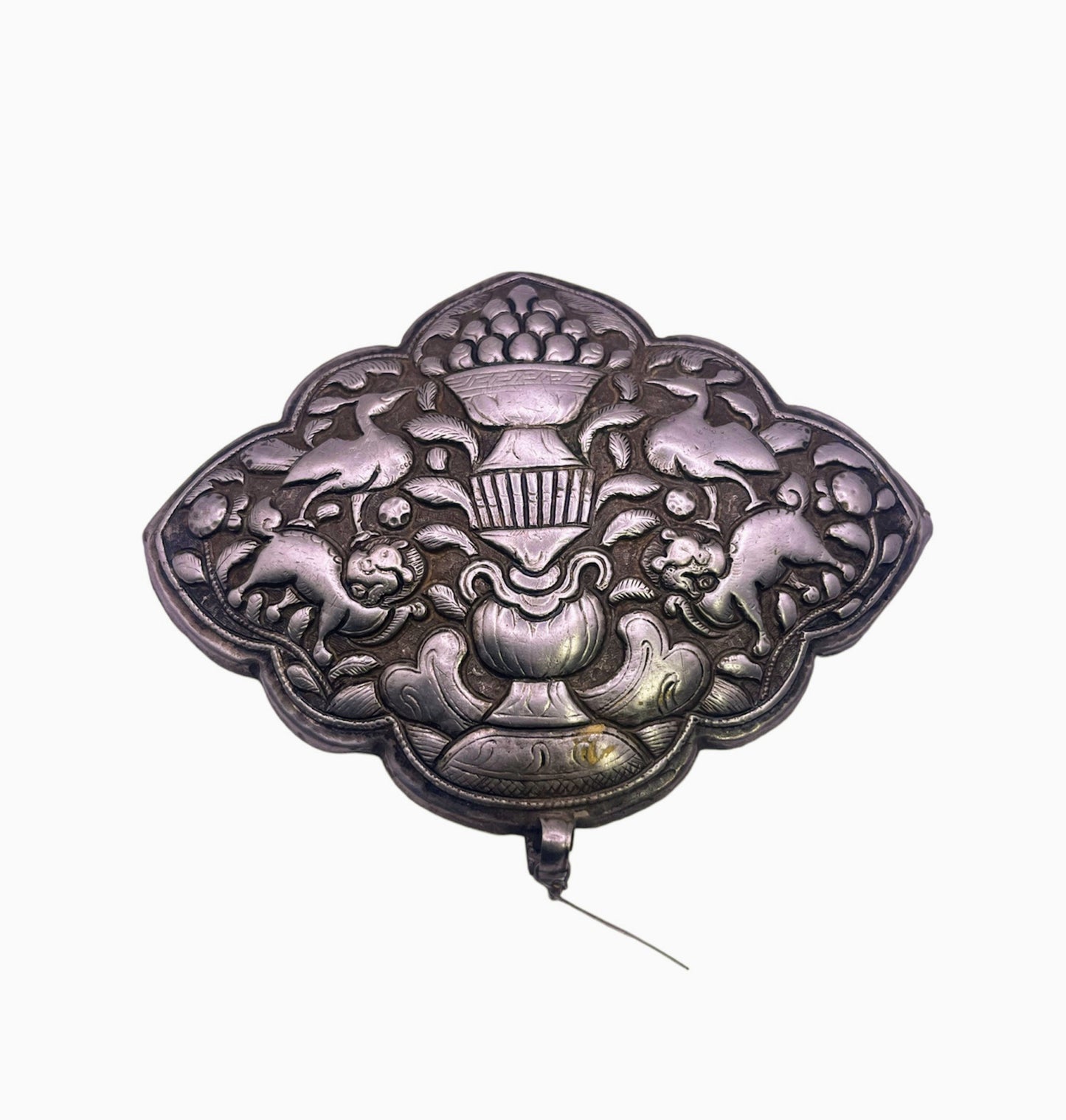 An antique Tibetan silver belt buckle